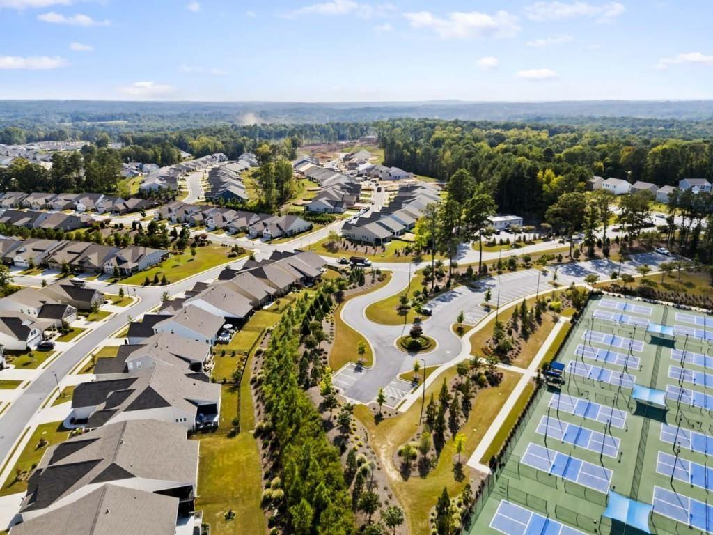 226 Geneva Way Hoschton, GA 30548 - Photo 77 of 84 an aerial view of residential building and parking space