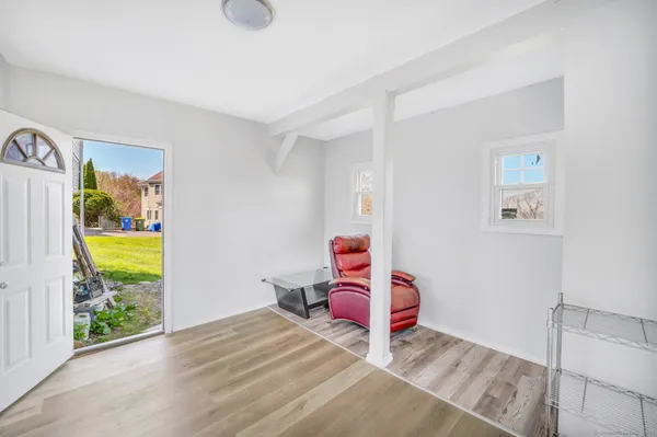 a room that has a bed and a chair in it