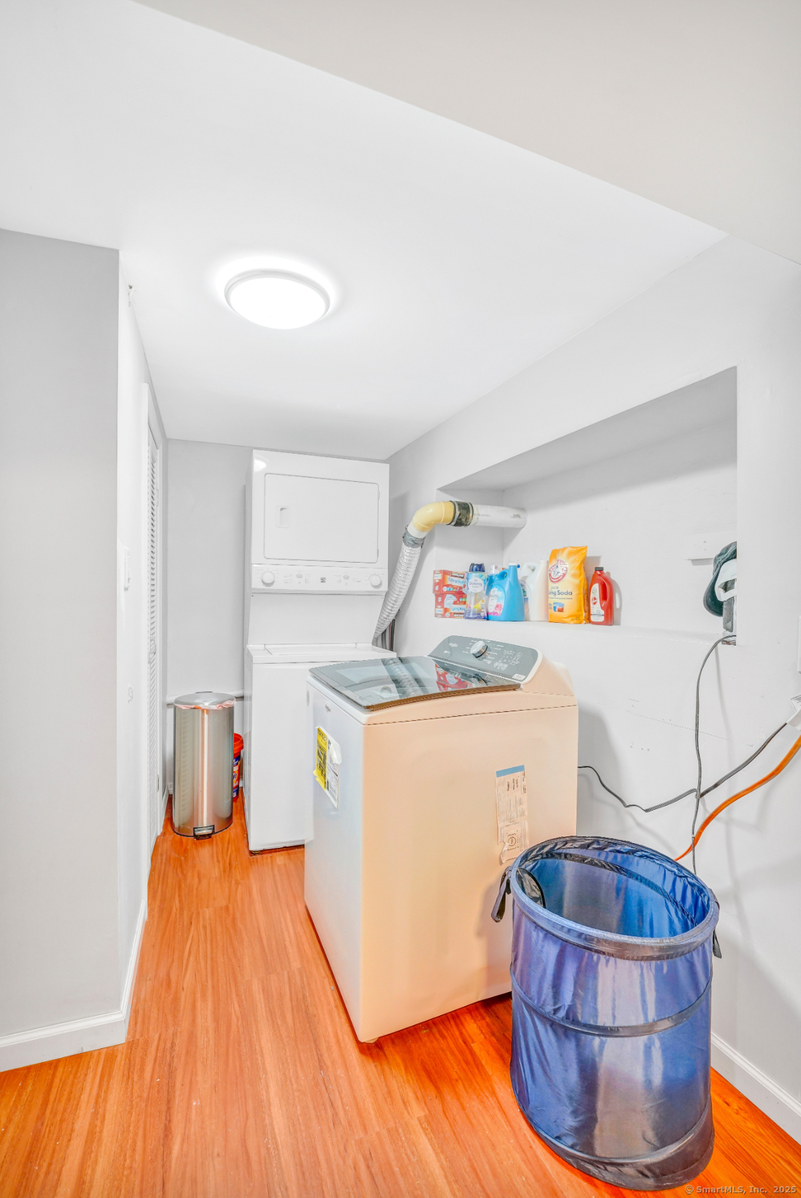 701 Bucks Hill Road Waterbury, CT 06704 - Photo 14 of 20 a room with a couch and a wooden floor