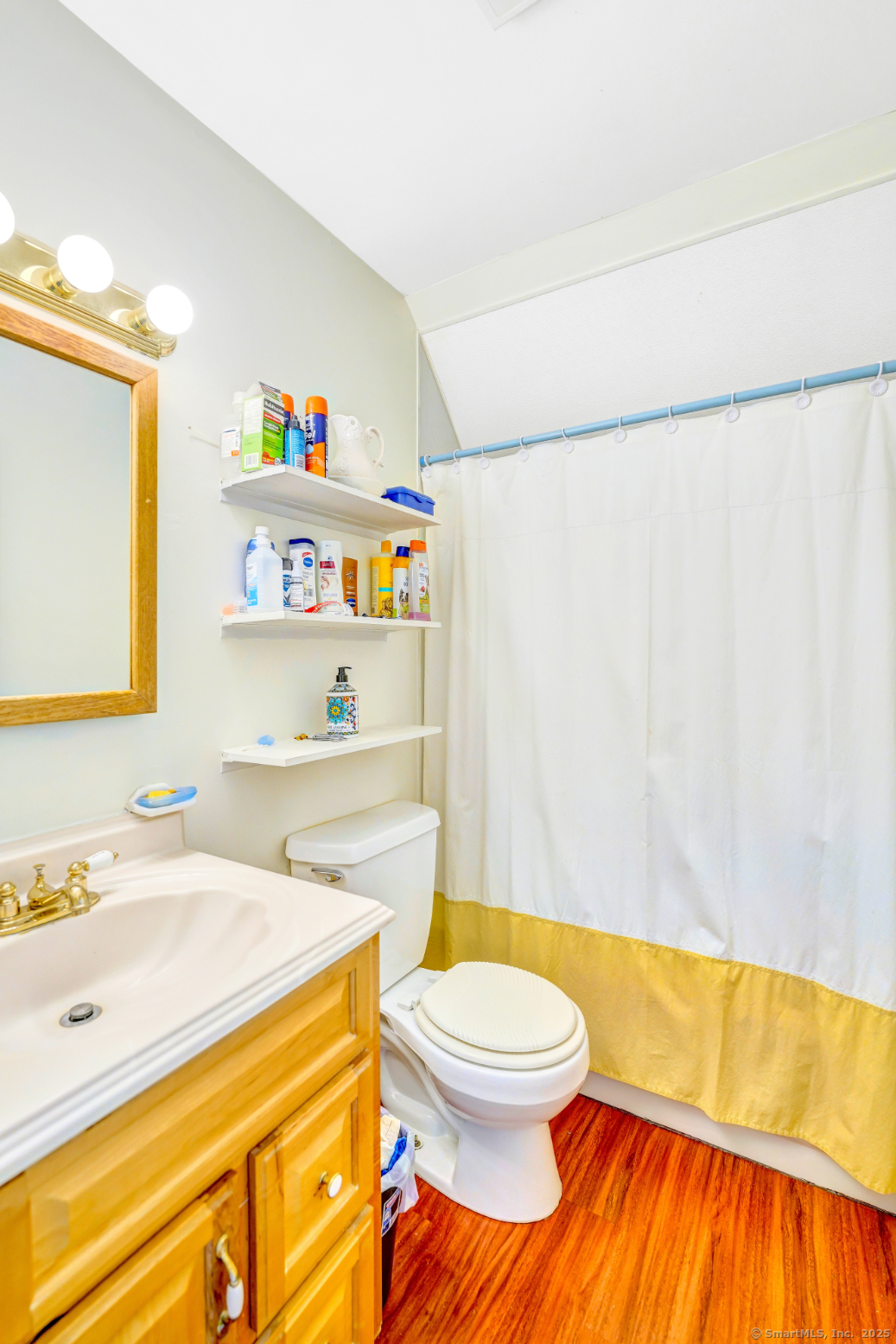 701 Bucks Hill Road Waterbury, CT 06704 - Photo 10 of 20 a bathroom with a sink a toilet and a shower curtain