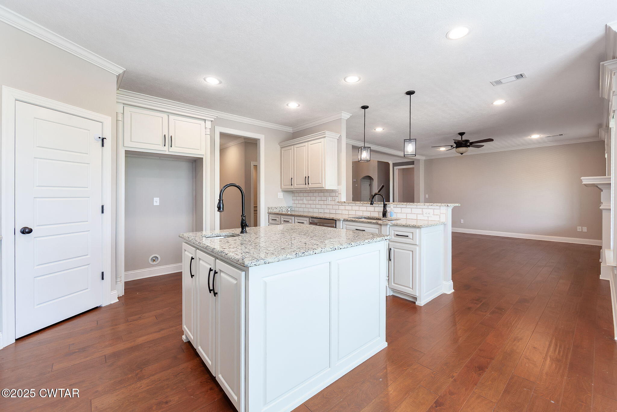 42 Cheddleton Cove Jackson, TN 38305 - Photo 11 of 37 a kitchen with a sink stainless steel appliances and cabinets