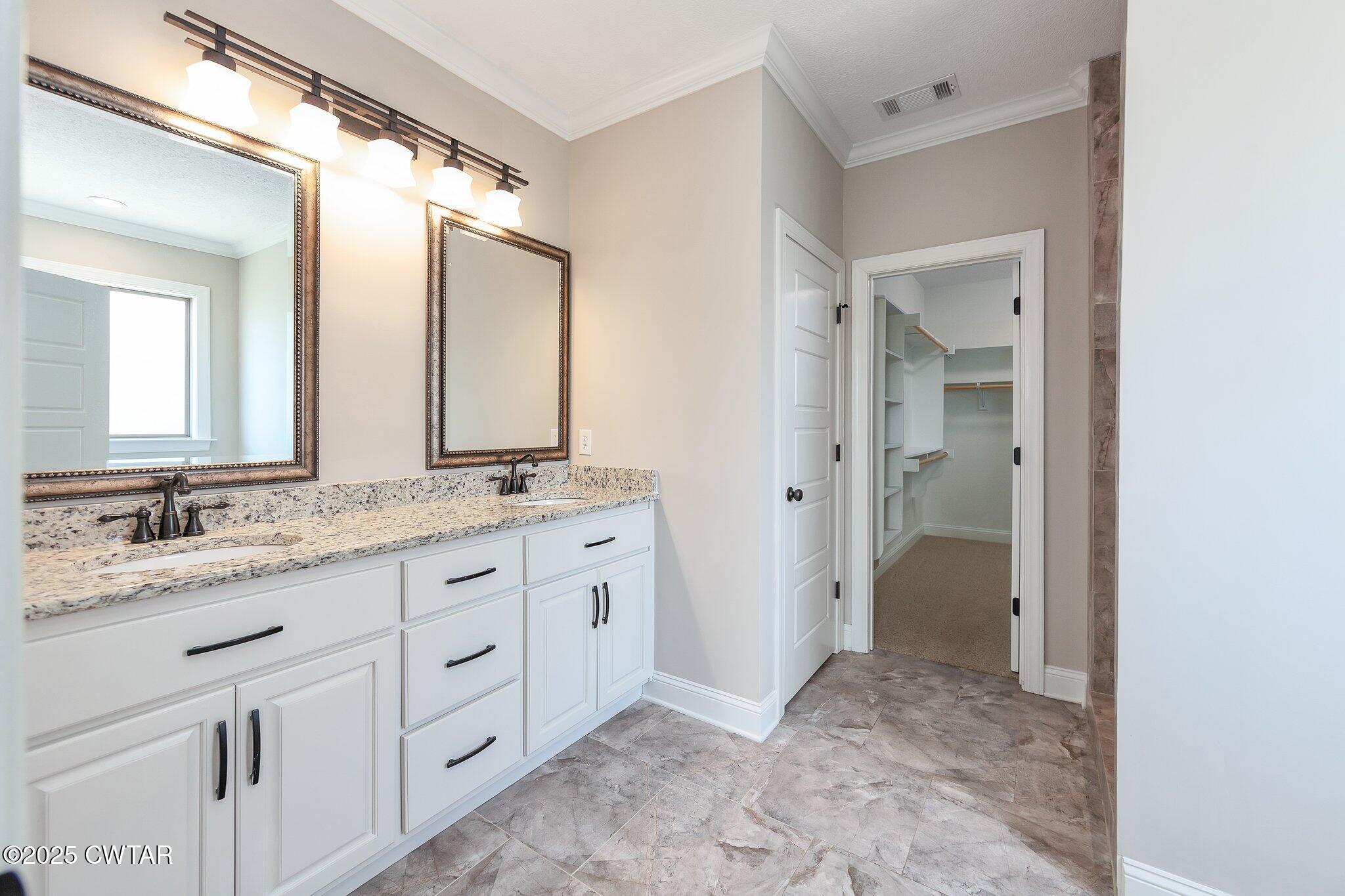 42 Cheddleton Cove Jackson, TN 38305 - Photo 15 of 37 a bathroom with a granite countertop sink mirror and a