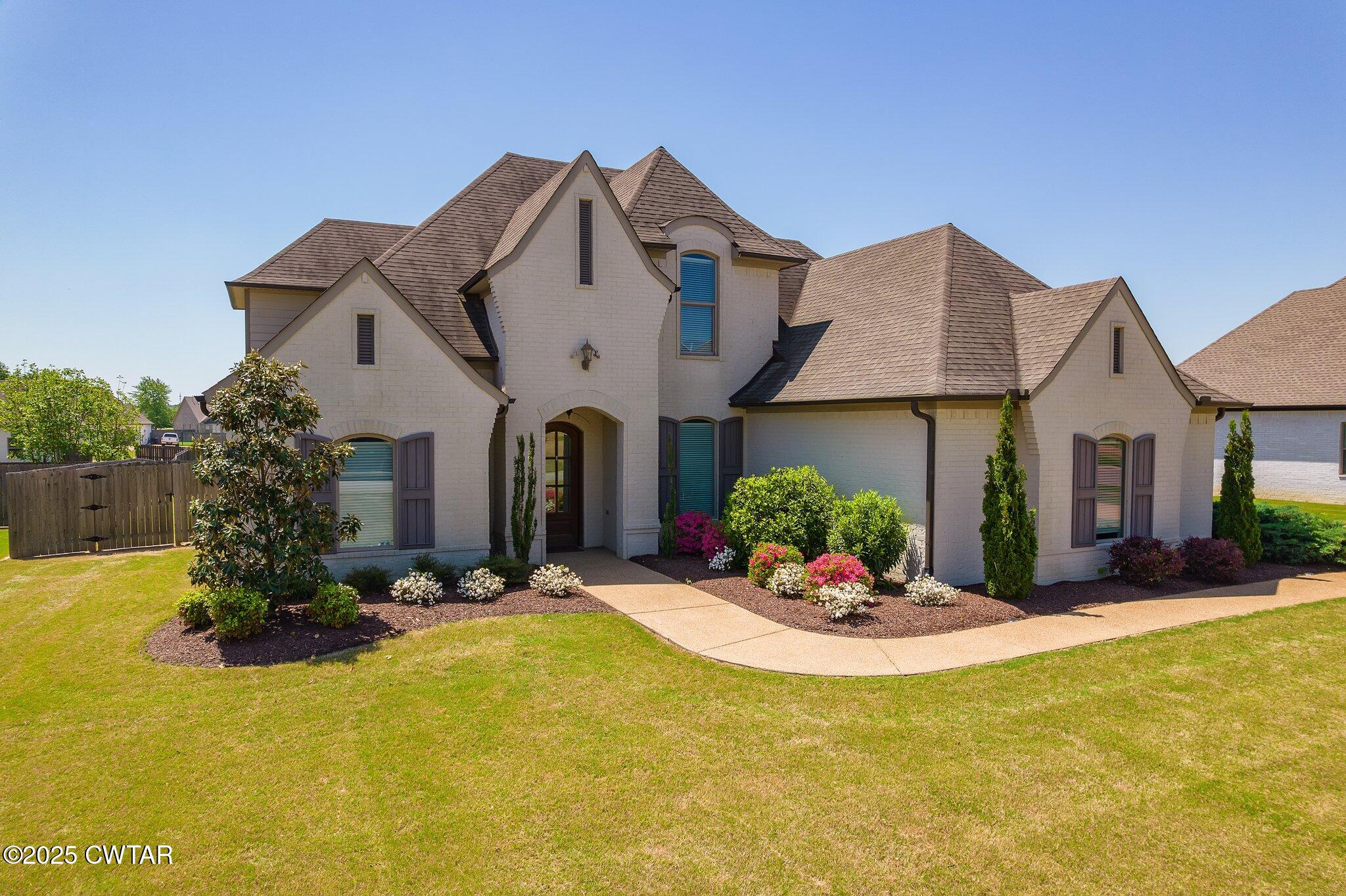 42 Cheddleton Cove Jackson, TN 38305 - Photo 2 of 37 a front view of a house with a yard