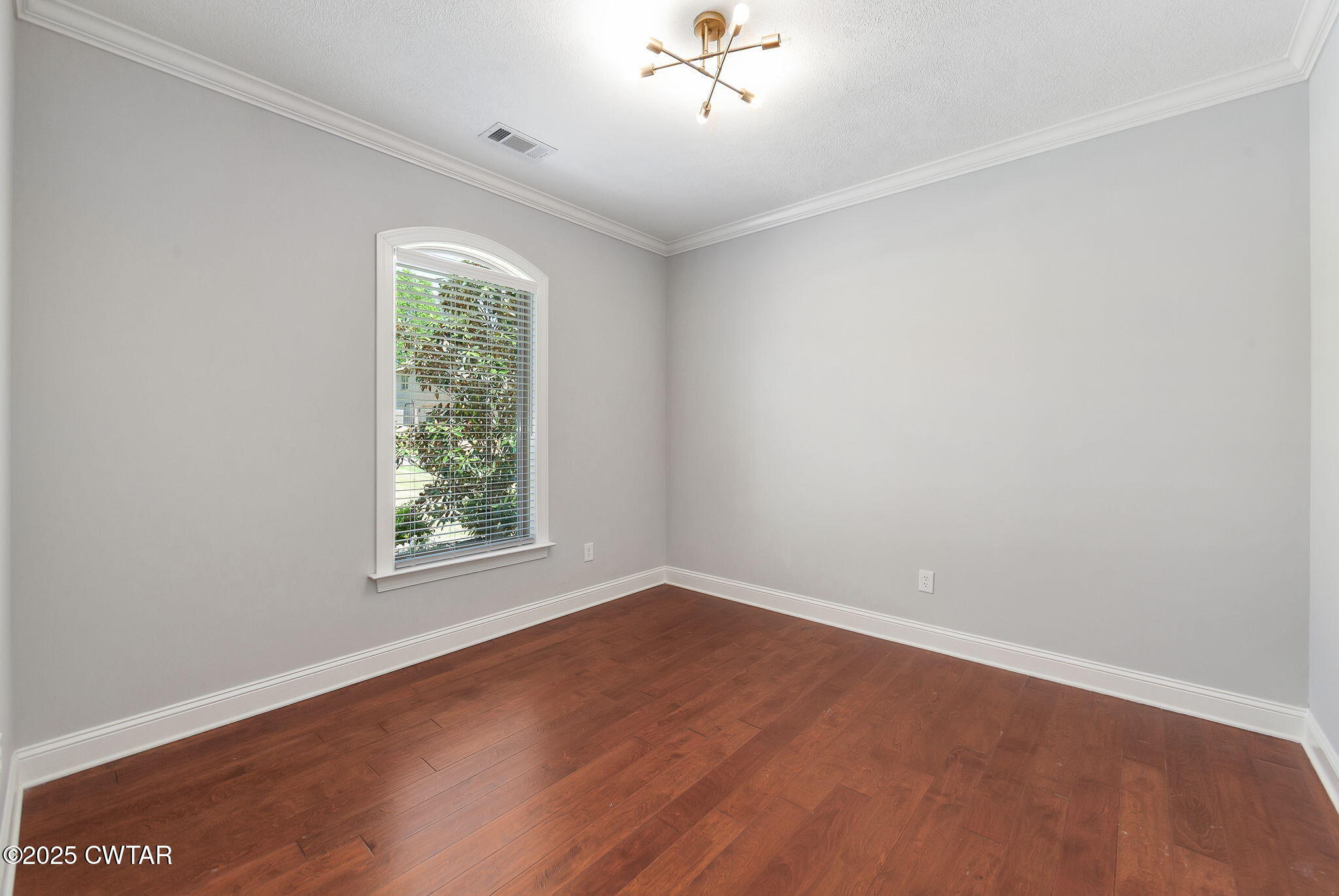 42 Cheddleton Cove Jackson, TN 38305 - Photo 21 of 37 an empty room with a window