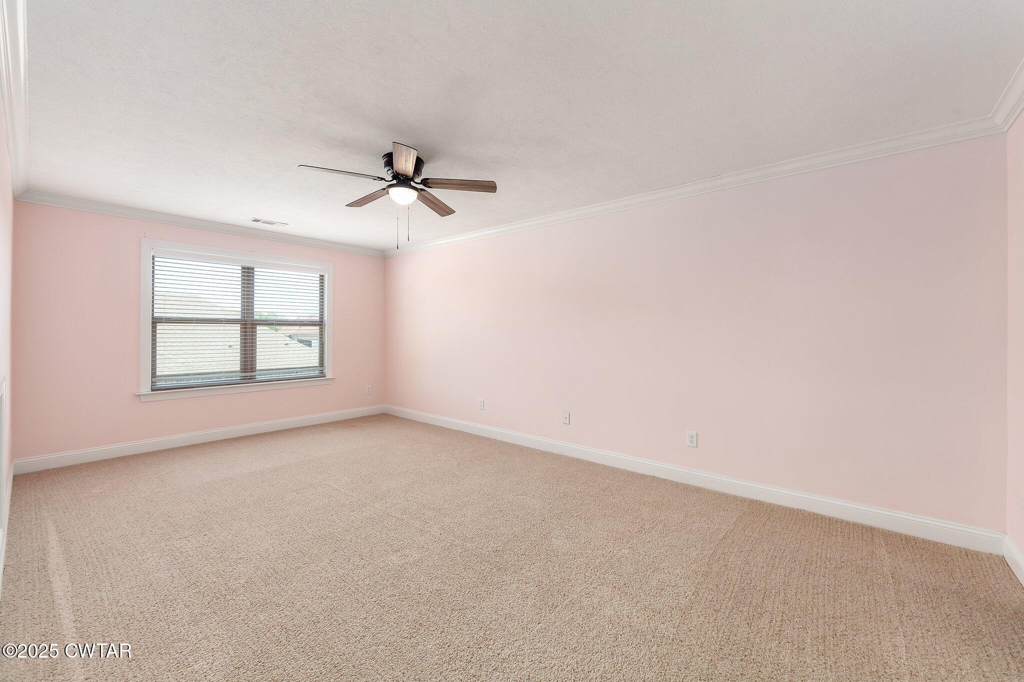 42 Cheddleton Cove Jackson, TN 38305 - Photo 24 of 37 an empty room with windows and ceiling fan