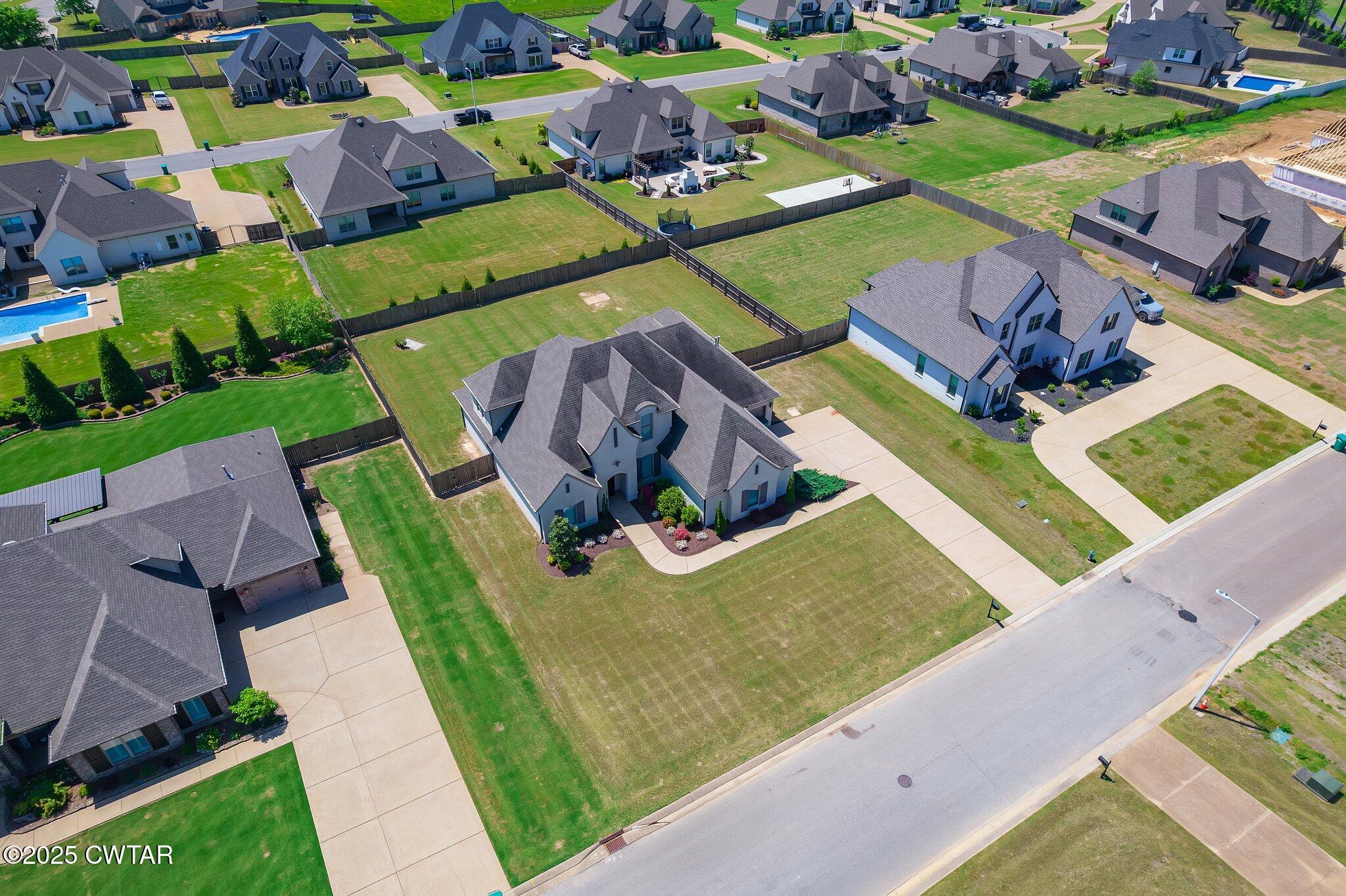 42 Cheddleton Cove Jackson, TN 38305 - Photo 3 of 37 an aerial view of a house with a garden