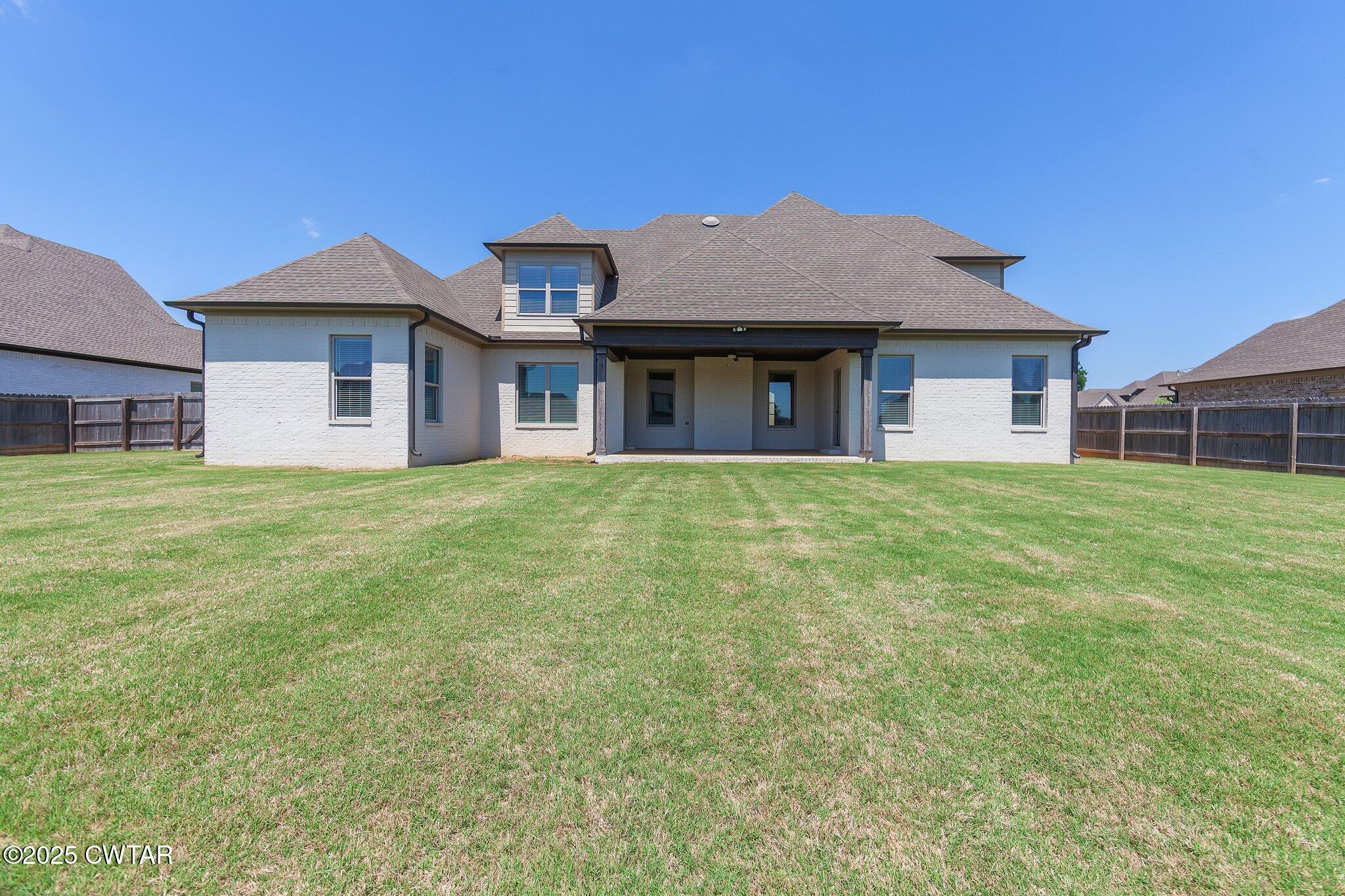 42 Cheddleton Cove Jackson, TN 38305 - Photo 32 of 37 a house with garden in front of it