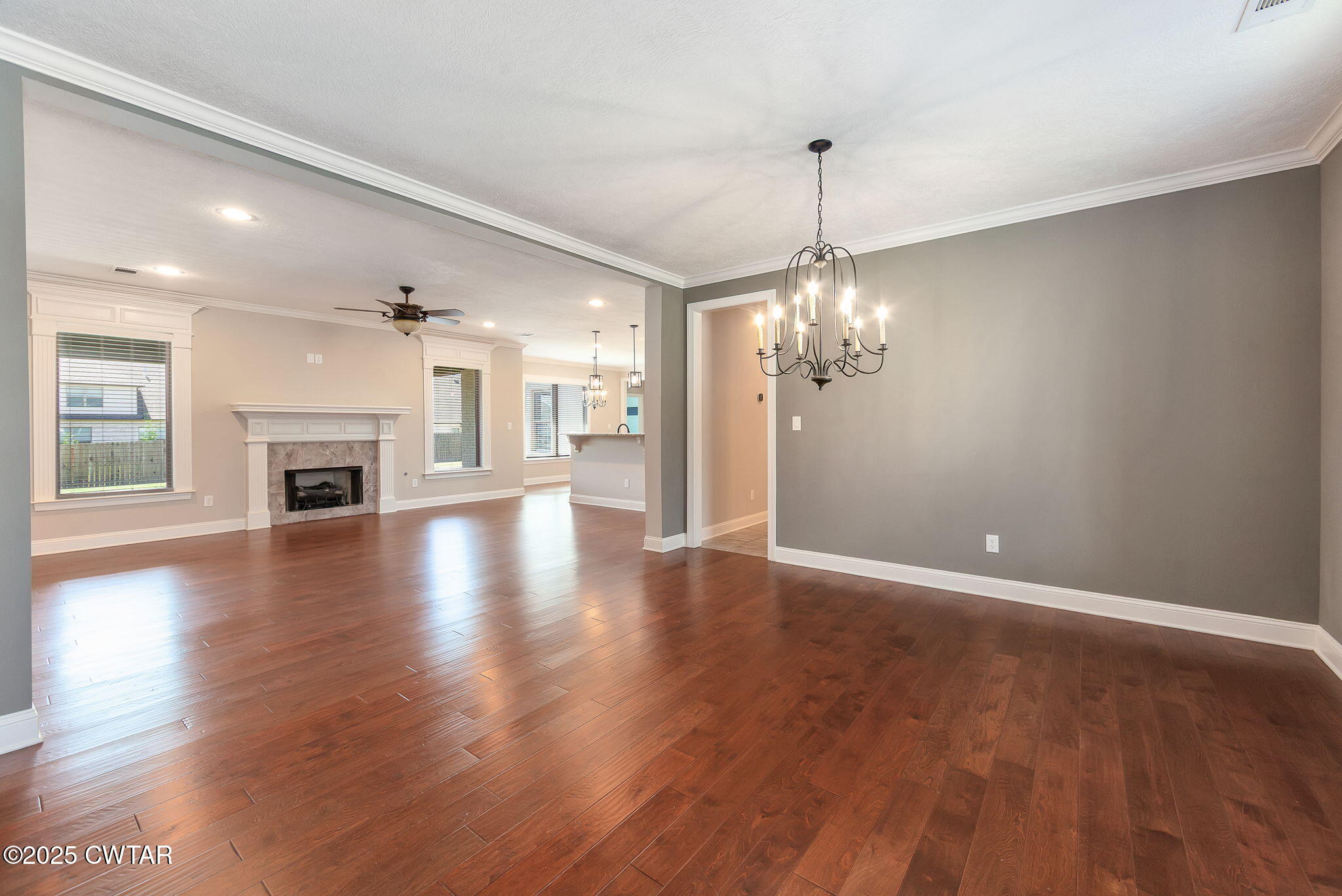 42 Cheddleton Cove Jackson, TN 38305 - Photo 5 of 37 a view of a livingroom with a fireplace wooden floor and a window