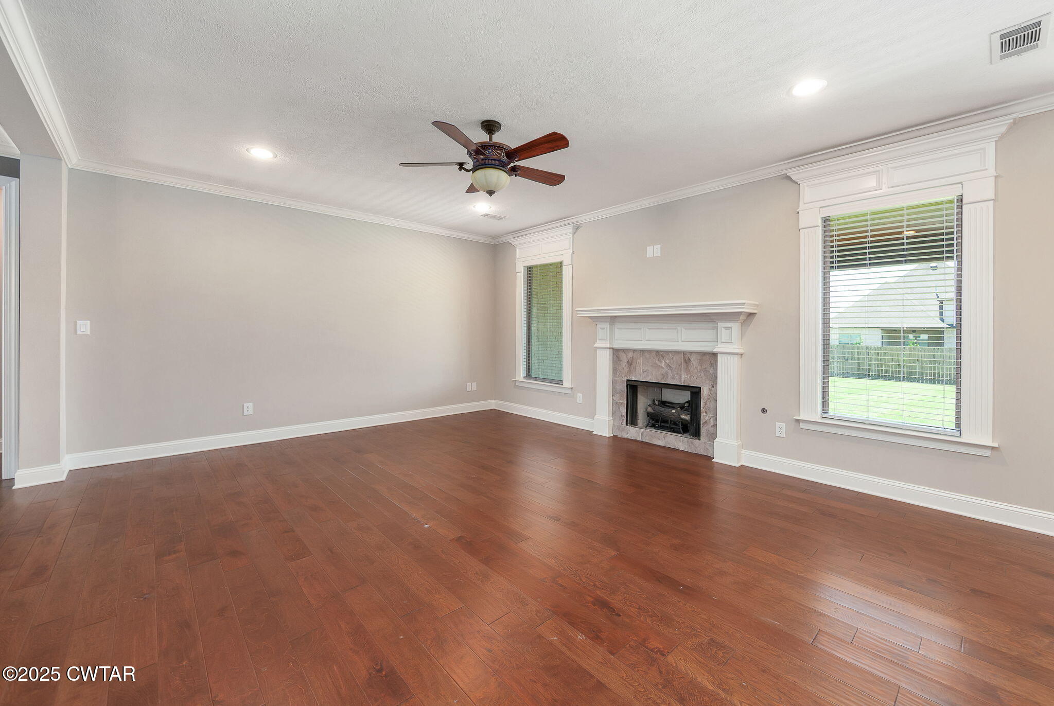 42 Cheddleton Cove Jackson, TN 38305 - Photo 7 of 37 a view of empty room with wooden floor and fireplace