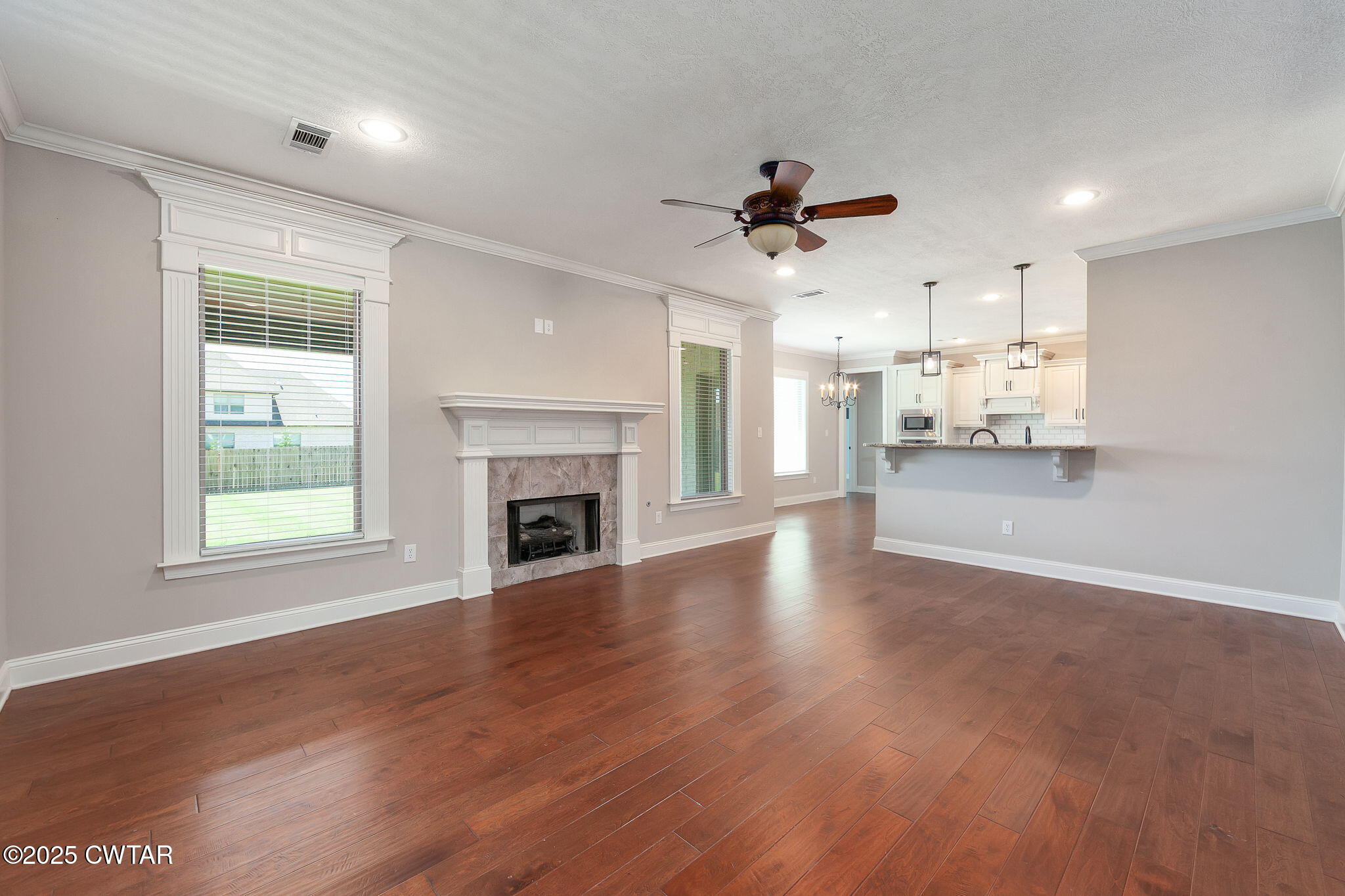 42 Cheddleton Cove Jackson, TN 38305 - Photo 8 of 37 a view of a kitchen with a stove cabinets and wooden floor