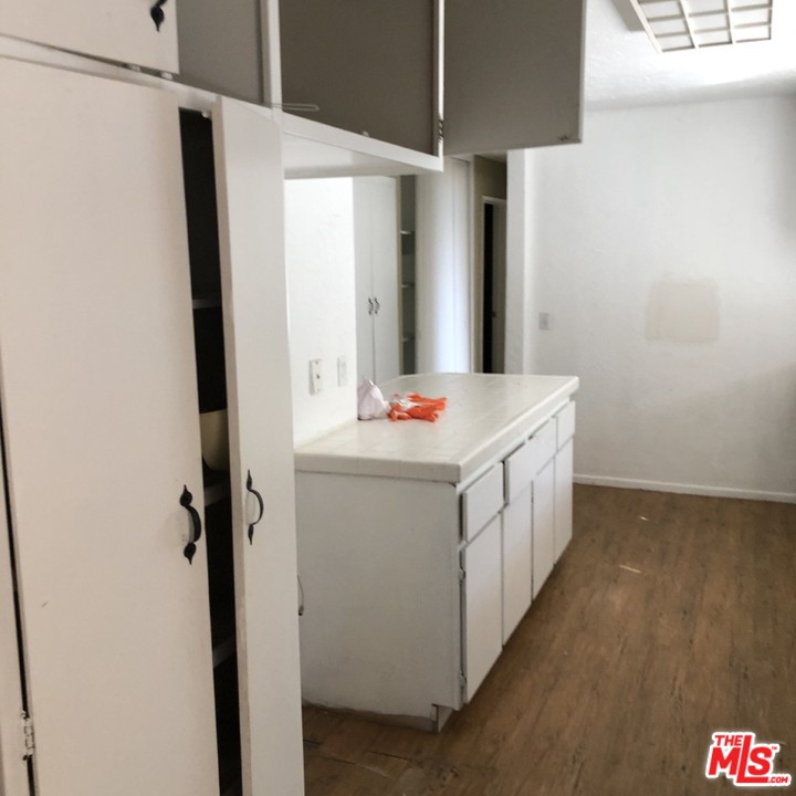 70071 Cobb Road Rancho Mirage, CA 92270 - Photo 6 of 22 a utility room with cabinets washer and dryer