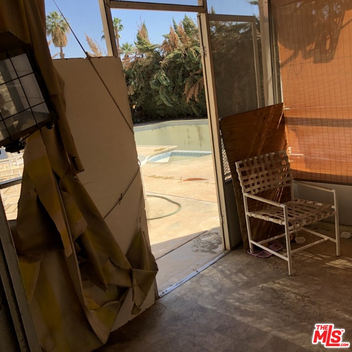 70071 Cobb Road Rancho Mirage, CA 92270 - Photo 7 of 22 a view of an empty room with a window