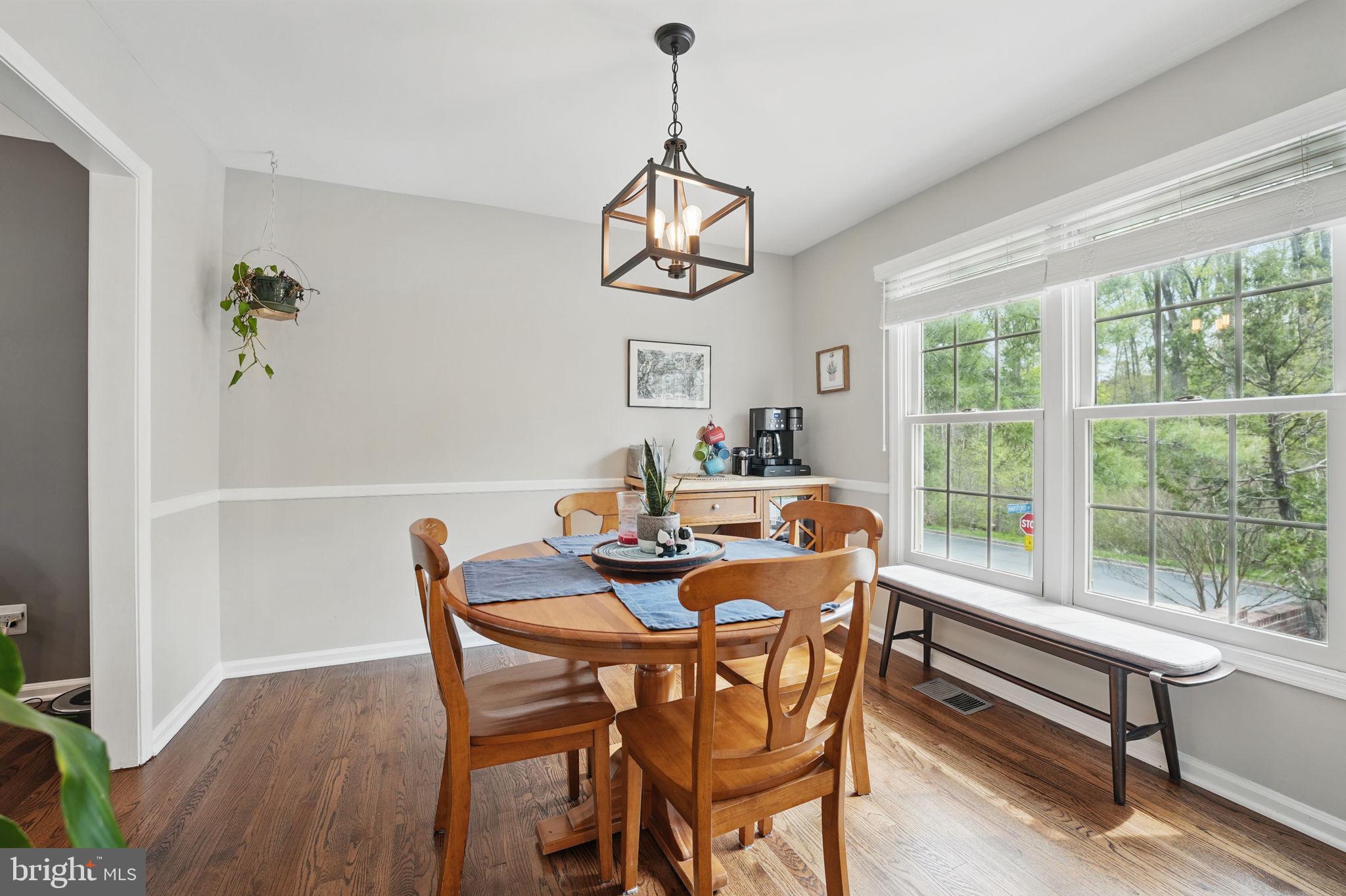 8333 Wickham Road Springfield, VA 22152 - Photo 12 of 54 a dining room with furniture window and wooden floor