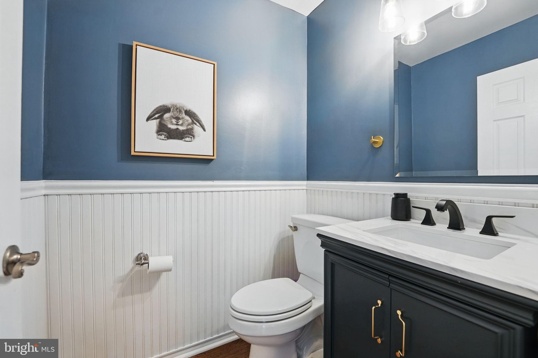8333 Wickham Road Springfield, VA 22152 - Photo 13 of 54 a bathroom with a toilet sink and mirror