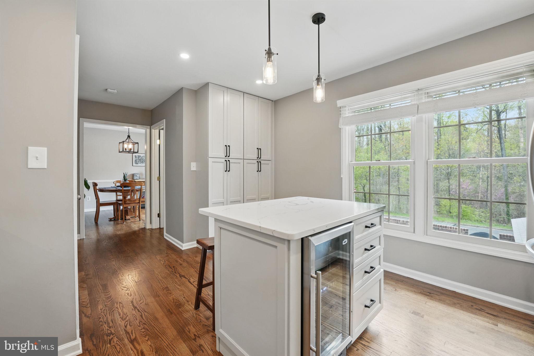 8333 Wickham Road Springfield, VA 22152 - Photo 18 of 54 a view of a kitchen with a sink cabinets and wooden floor