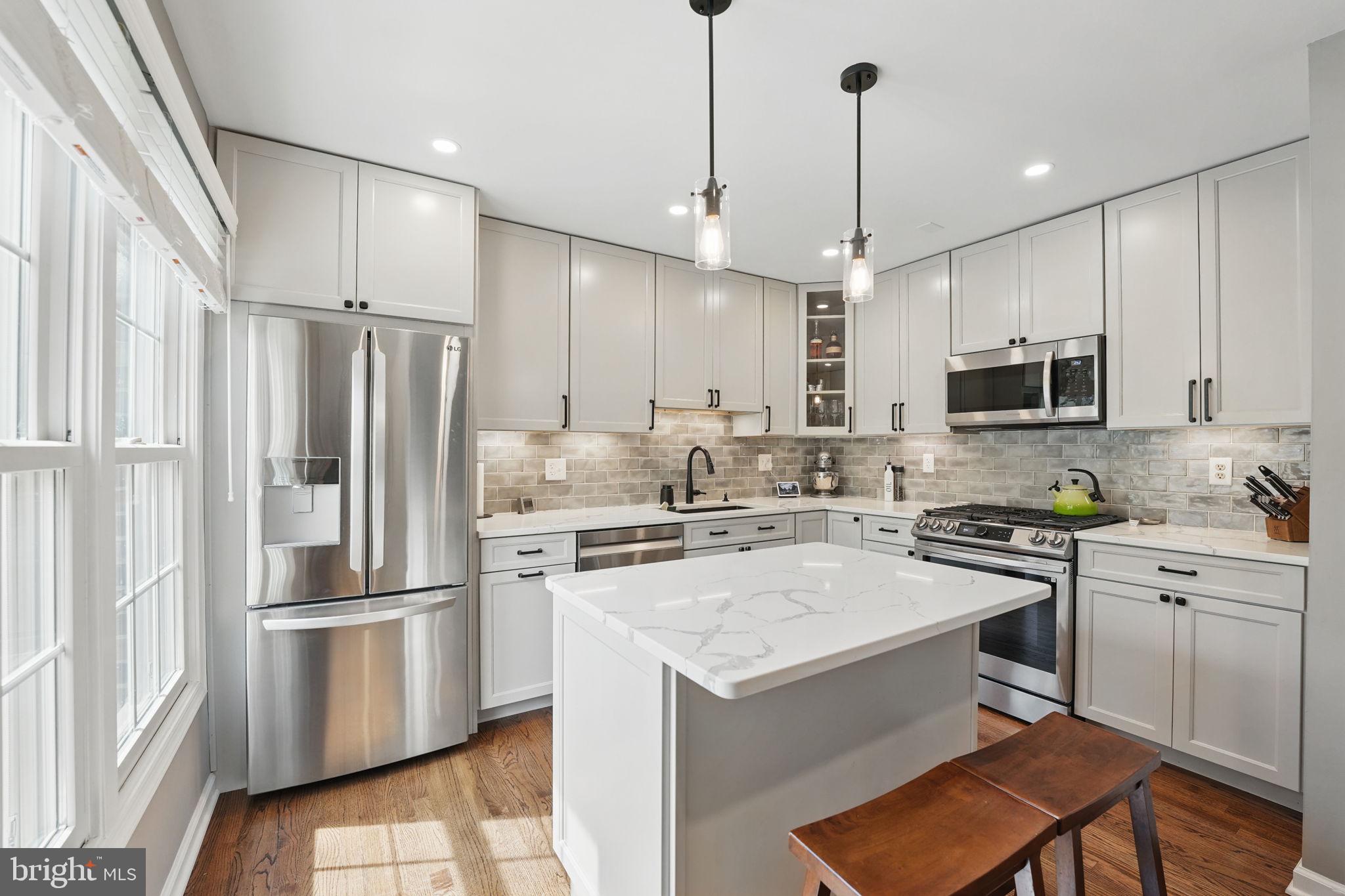 8333 Wickham Road Springfield, VA 22152 - Photo 20 of 54 a kitchen with a refrigerator a sink and microwave
