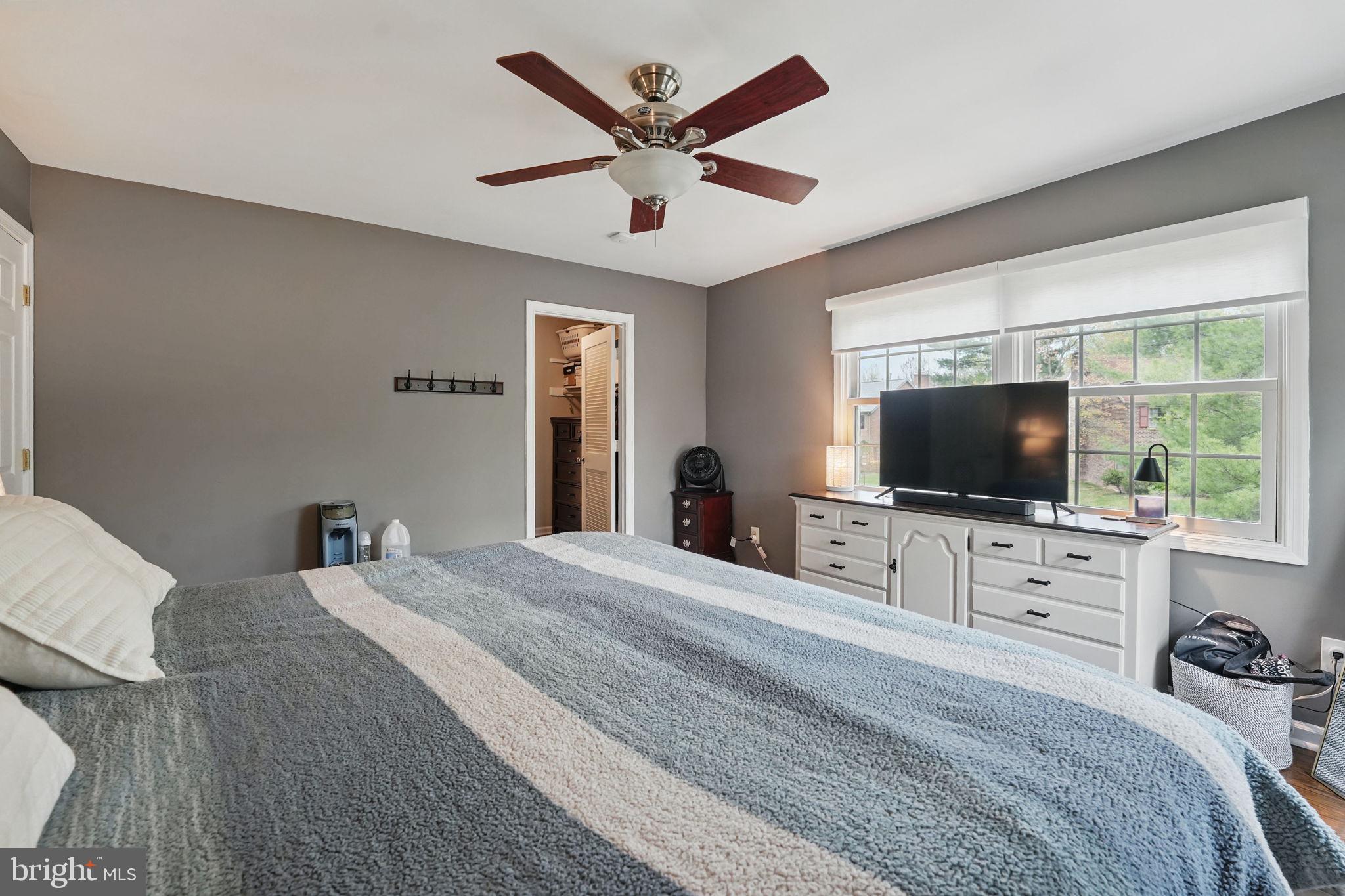 8333 Wickham Road Springfield, VA 22152 - Photo 26 of 54 a bedroom with a bed and a flat screen tv
