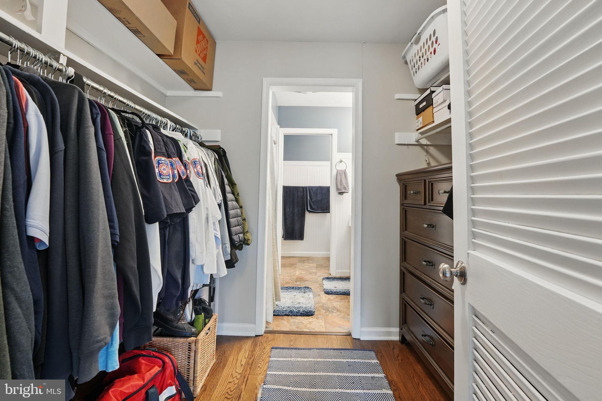 8333 Wickham Road Springfield, VA 22152 - Photo 27 of 54 a view of walk in closet with clothes and shoes