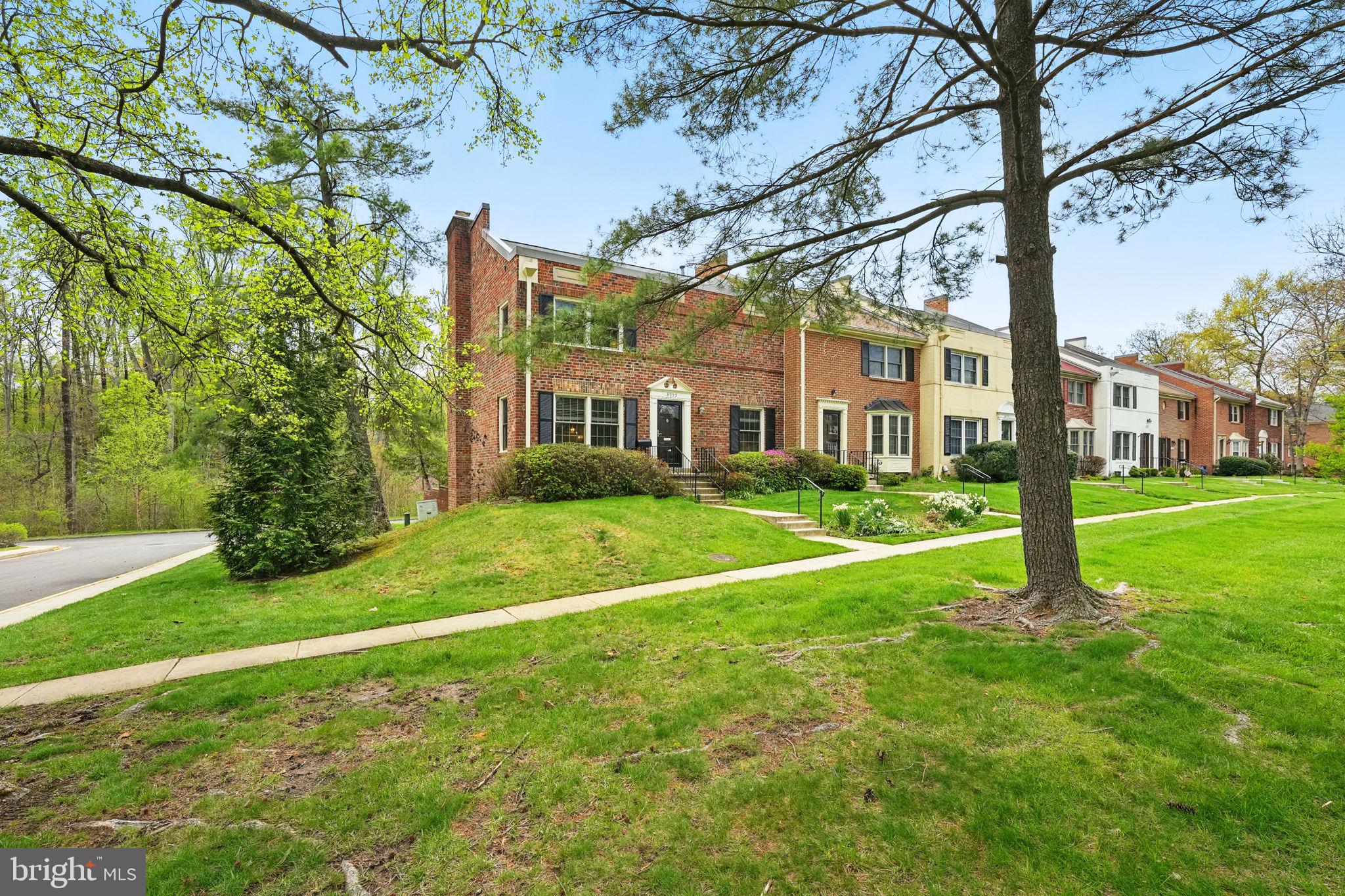 8333 Wickham Road Springfield, VA 22152 - Photo 3 of 54 a view of a big house with a big yard and large trees