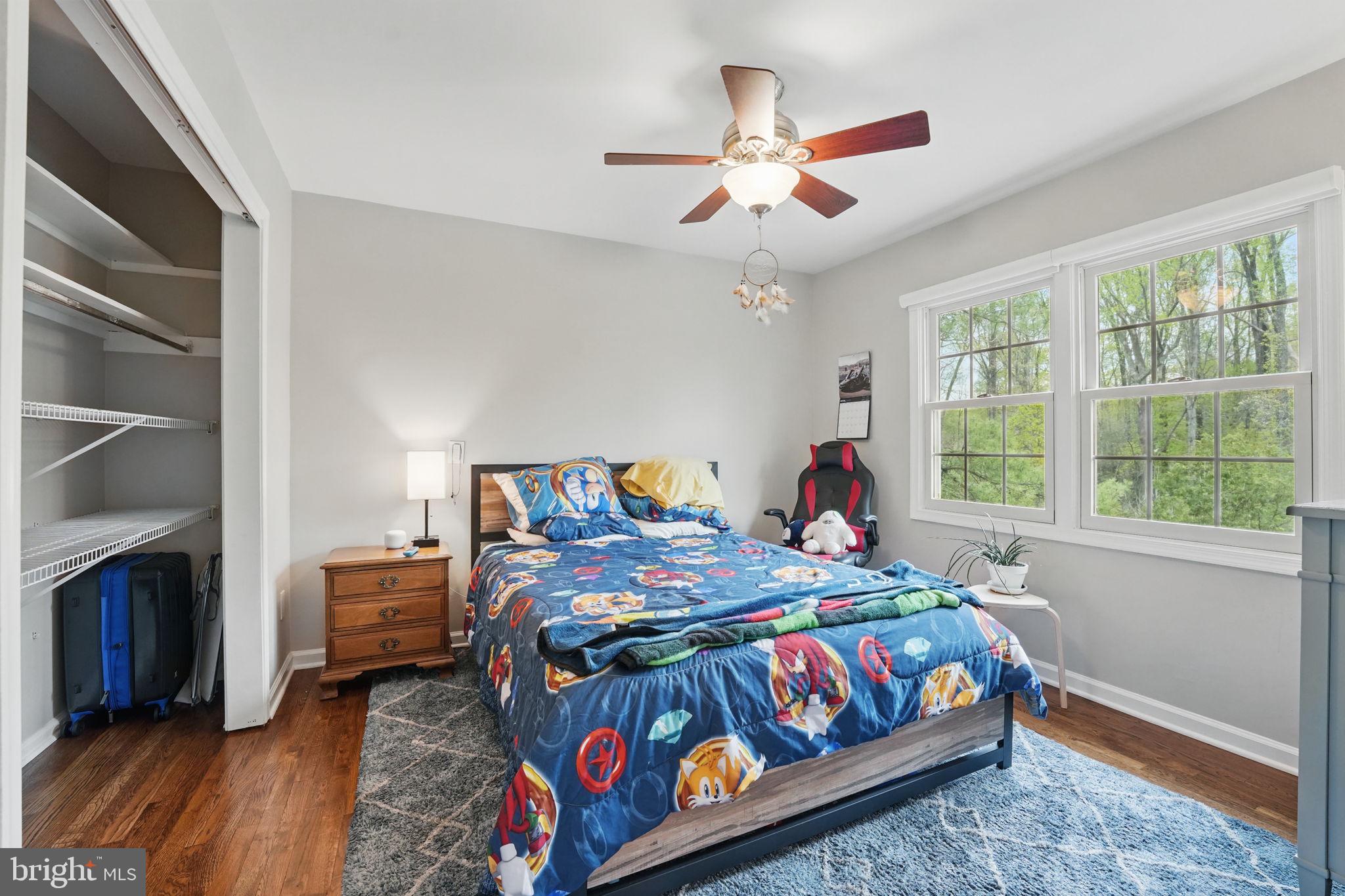 8333 Wickham Road Springfield, VA 22152 - Photo 31 of 54 a bedroom with a bed and a chandelier