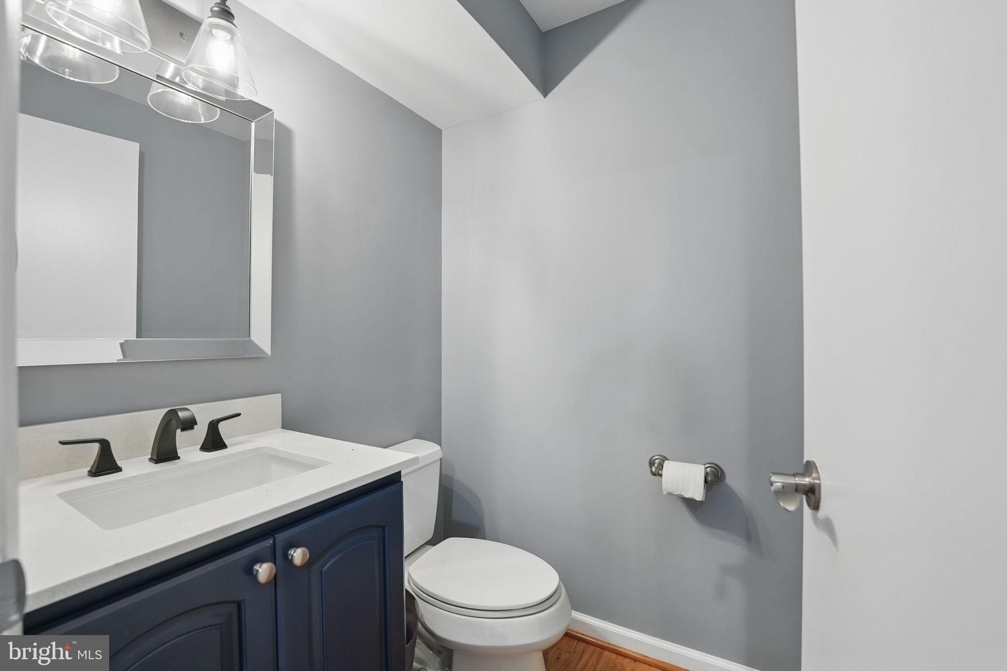 8333 Wickham Road Springfield, VA 22152 - Photo 37 of 54 a bathroom with a sink vanity and toilet