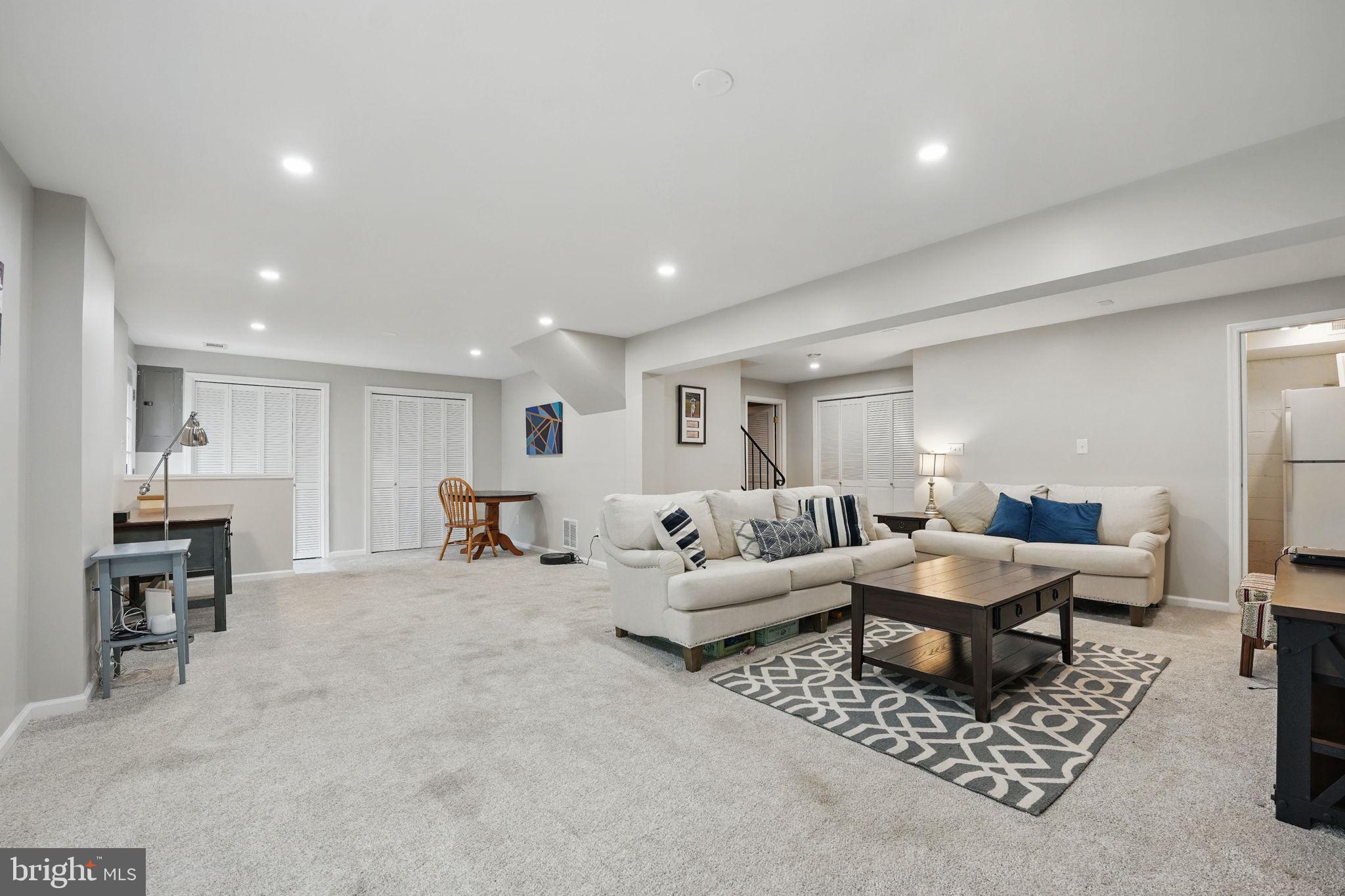 8333 Wickham Road Springfield, VA 22152 - Photo 40 of 54 a living room with furniture and a table
