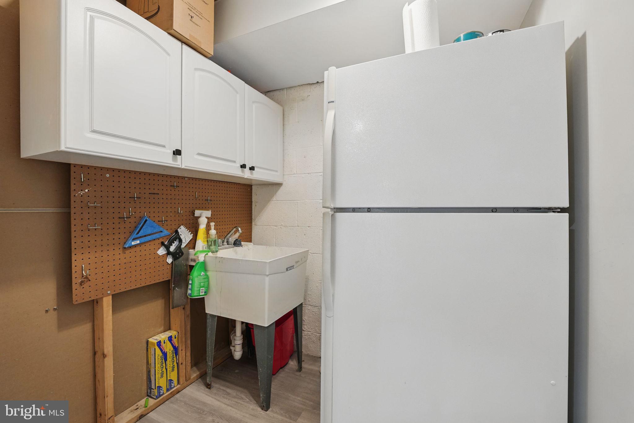 8333 Wickham Road Springfield, VA 22152 - Photo 43 of 54 a close view of a refrigerator a stove and a refrigerator