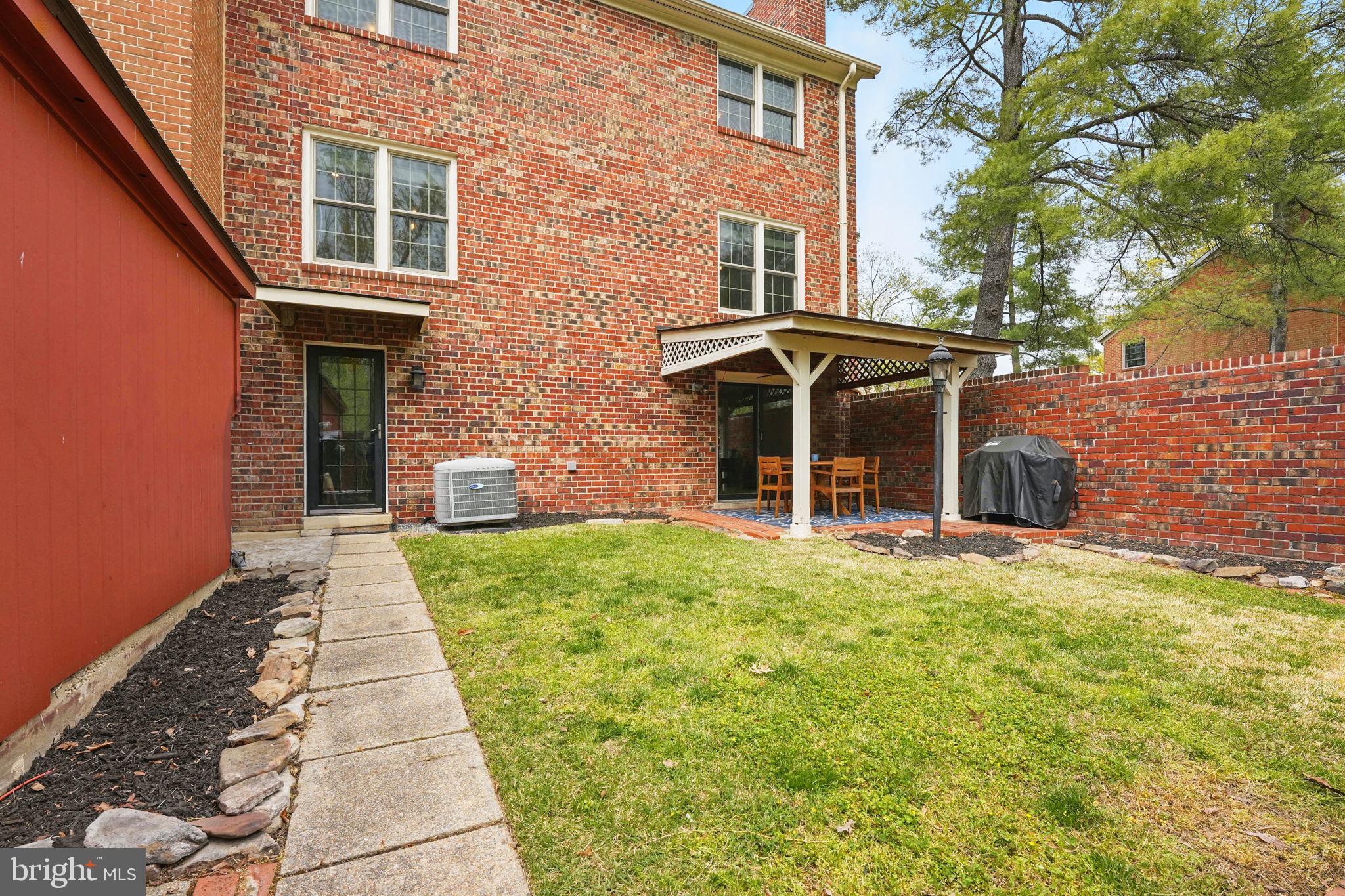 8333 Wickham Road Springfield, VA 22152 - Photo 47 of 54 a front view of a house with a yard