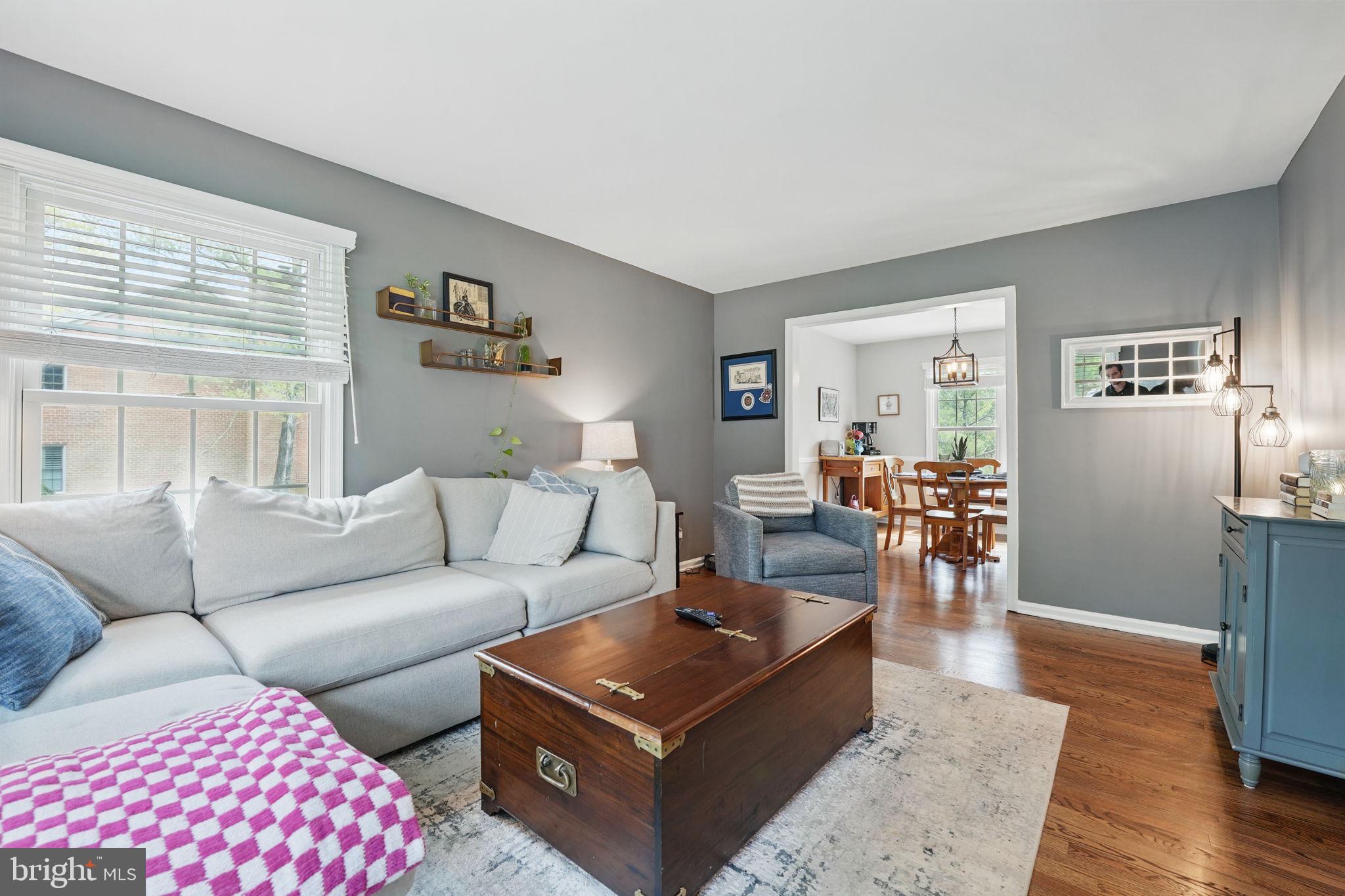 8333 Wickham Road Springfield, VA 22152 - Photo 8 of 54 a living room with furniture a wooden floor and a window