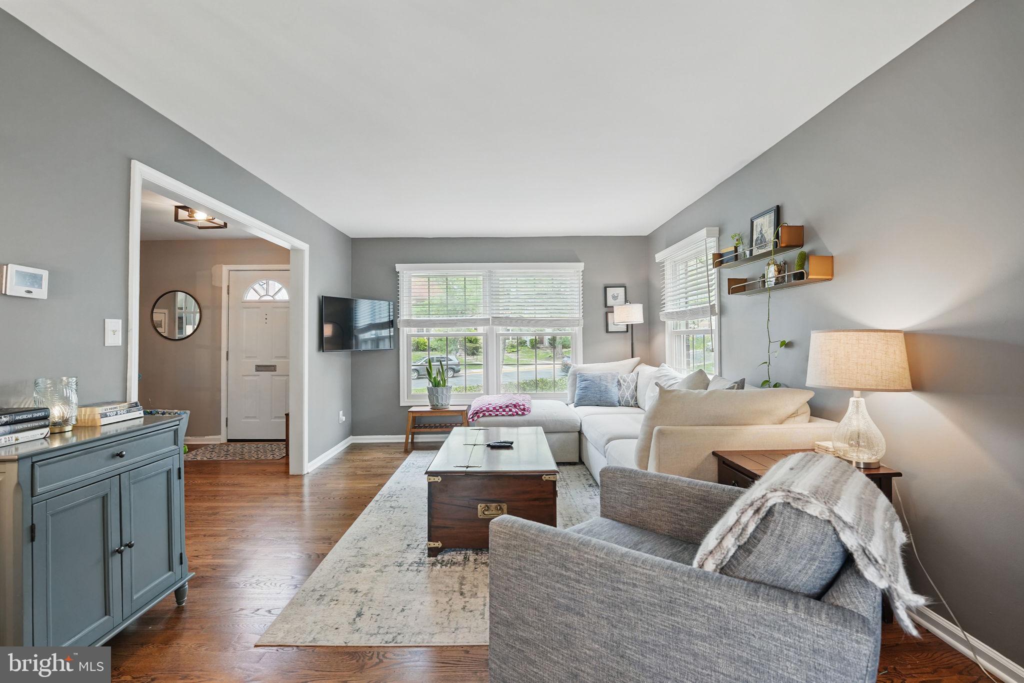 8333 Wickham Road Springfield, VA 22152 - Photo 9 of 54 a living room with furniture and a large window