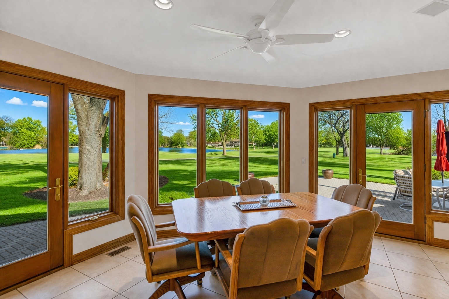 2321 Coach Road Long Grove, IL 60047 - Photo 18 of 83 a view of a dining room with furniture large windows and outside view