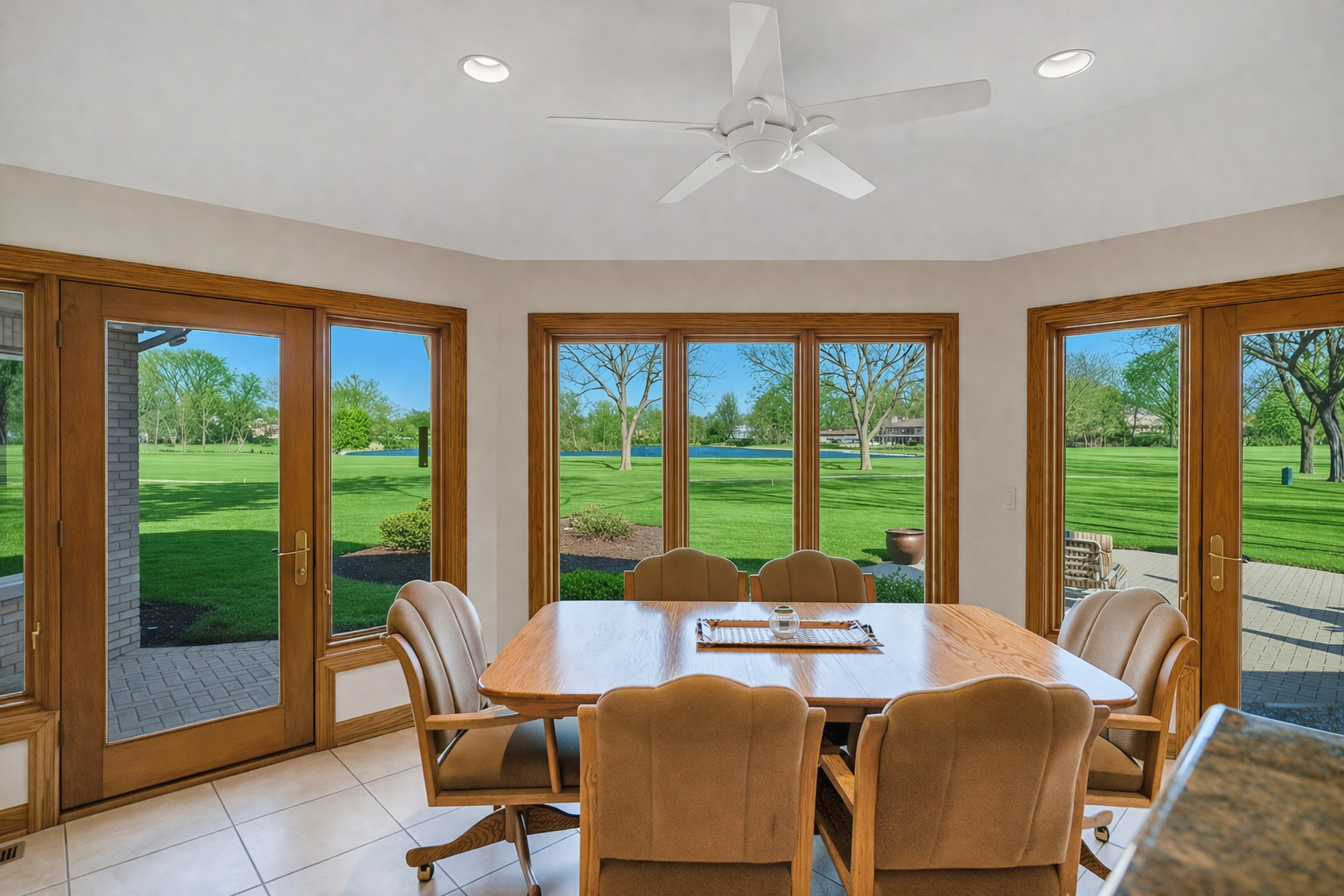 2321 Coach Road Long Grove, IL 60047 - Photo 20 of 83 a view of a dining room with furniture large windows and wooden floor