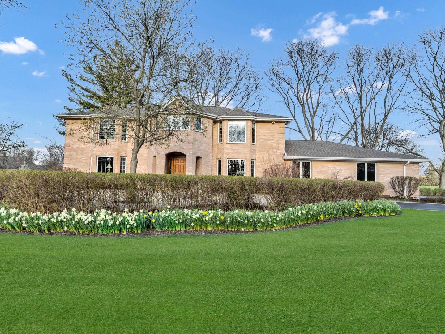 2321 Coach Road Long Grove, IL 60047 - Photo 2 of 83 a front view of a house with a garden