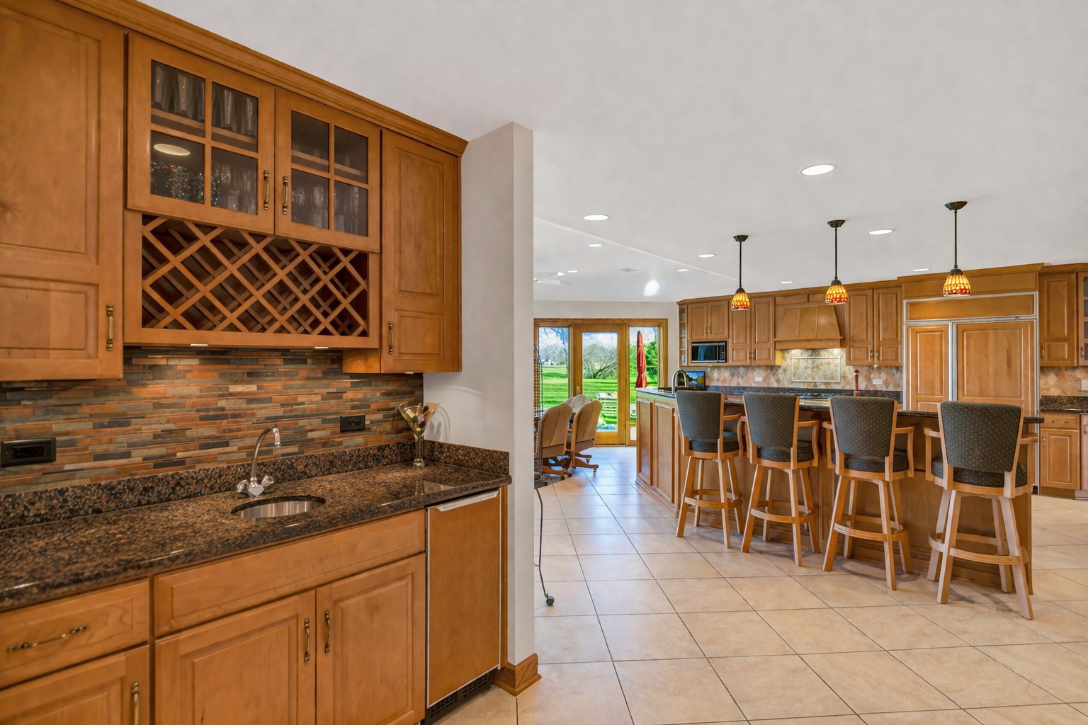 2321 Coach Road Long Grove, IL 60047 - Photo 30 of 83 a kitchen with stainless steel appliances granite countertop a stove a sink and a microwave