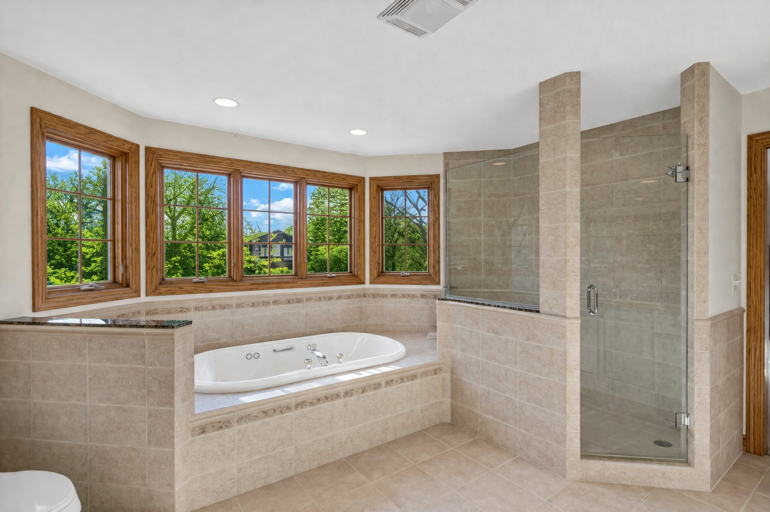 2321 Coach Road Long Grove, IL 60047 - Photo 46 of 83 a bathroom with a bathtub and large window