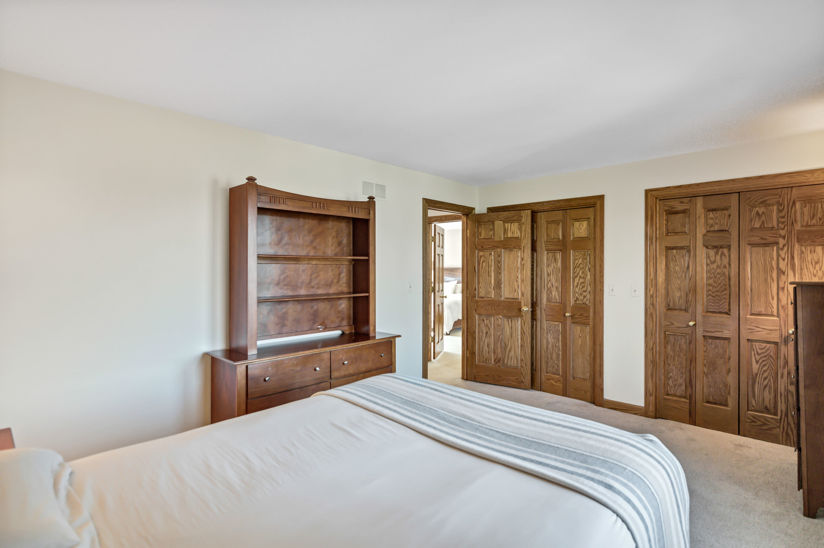 2321 Coach Road Long Grove, IL 60047 - Photo 56 of 83 a bedroom with a bed and a window