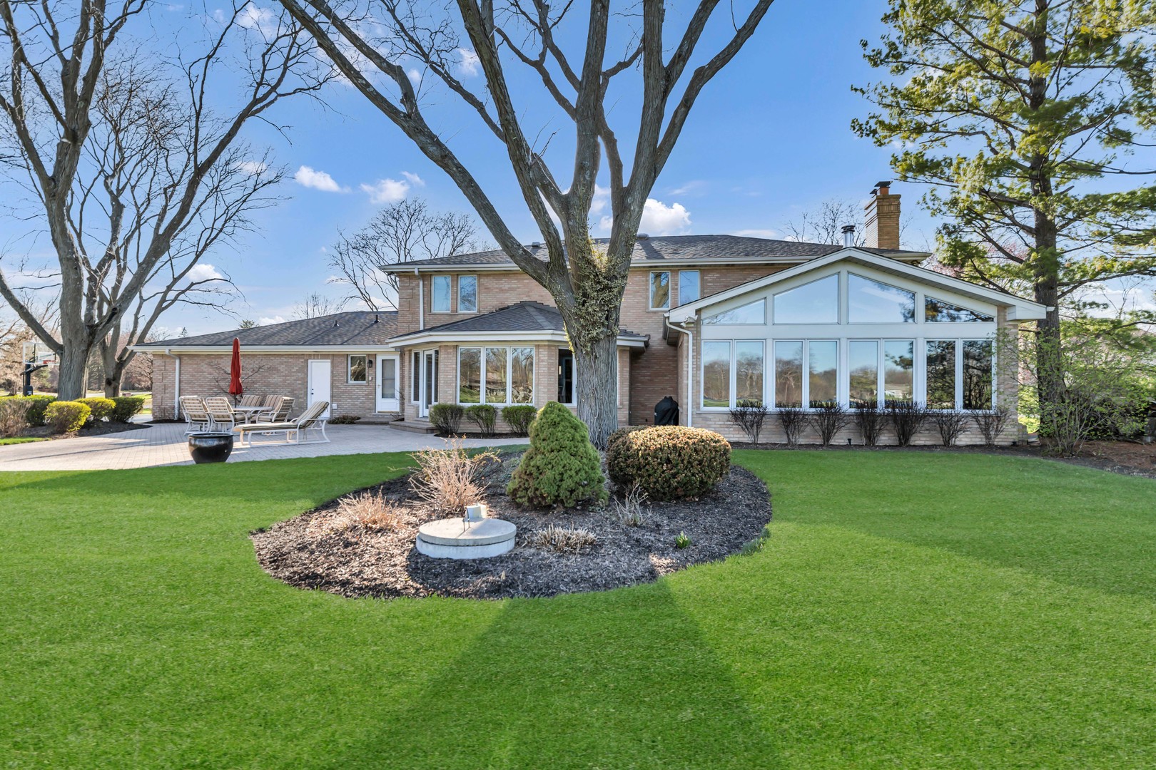 2321 Coach Road Long Grove, IL 60047 - Photo 68 of 83 a front view of a house with a garden and trees