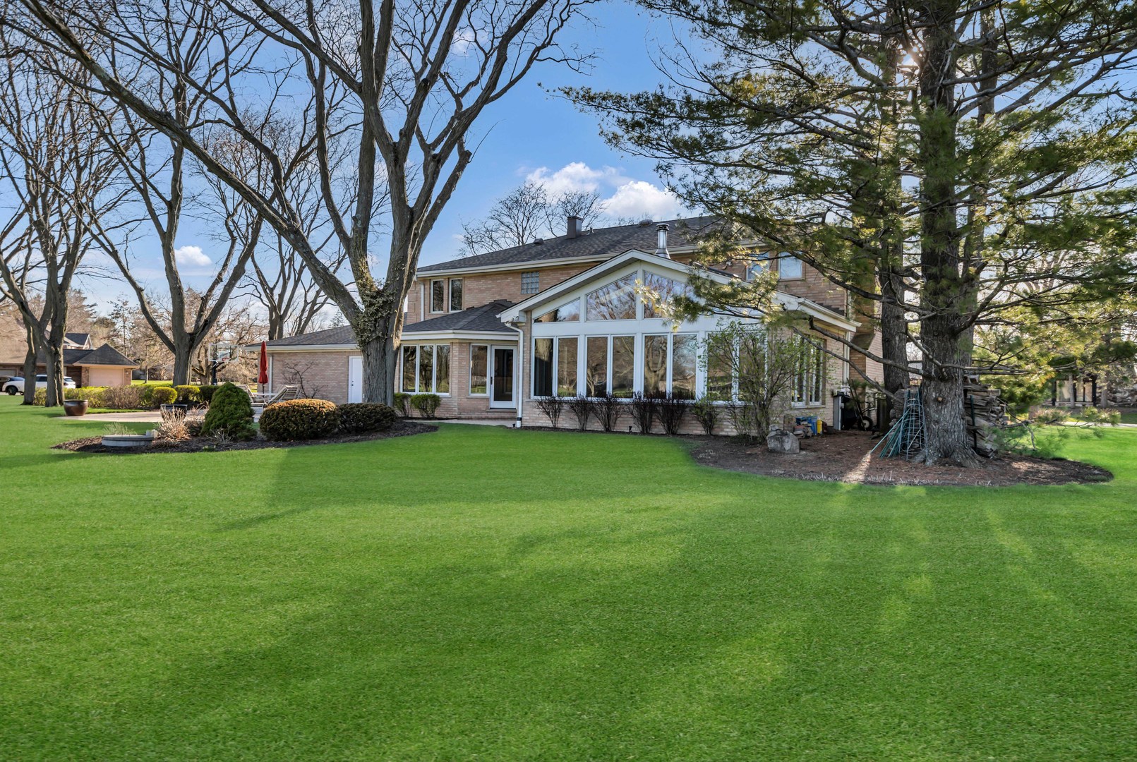 2321 Coach Road Long Grove, IL 60047 - Photo 75 of 83 a view of a house with a big yard and large trees