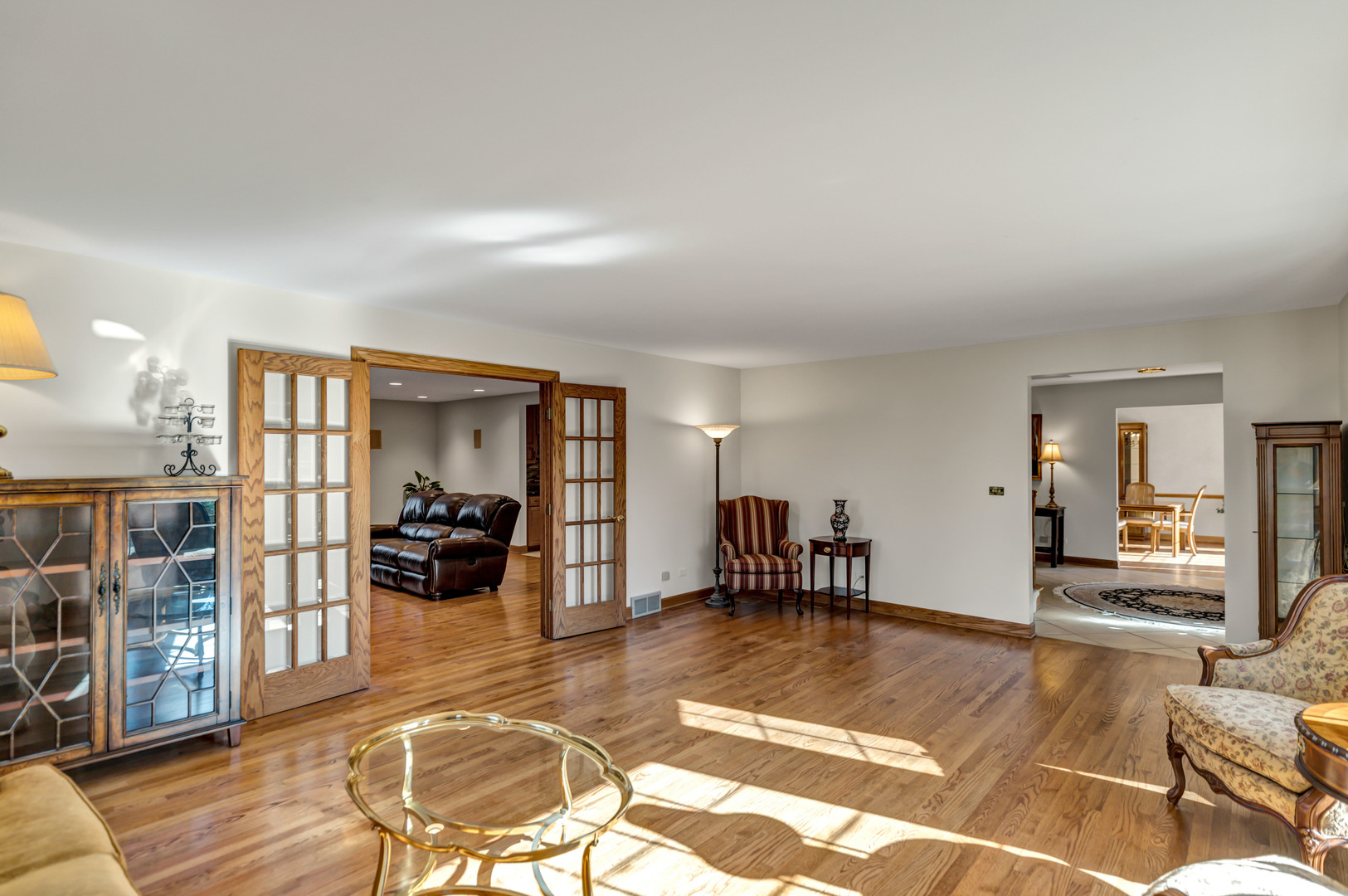 2321 Coach Road Long Grove, IL 60047 - Photo 8 of 83 a living room with furniture a dining table and chairs with wooden floor
