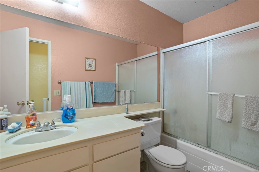 7823 Ramona Avenue Rancho Cucamonga, CA 91730 - Photo 11 of 18 a bathroom with a sink a toilet and shower
