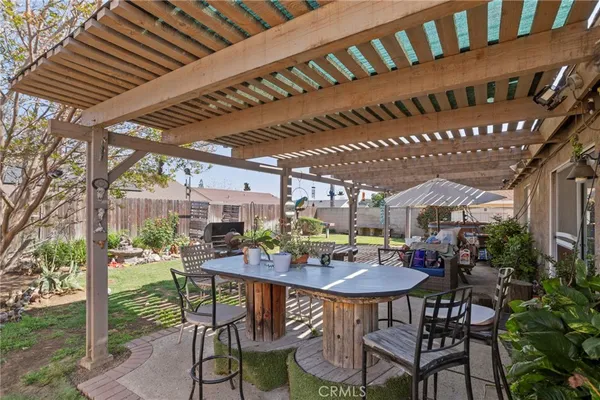 a view of a chairs and table in the patio