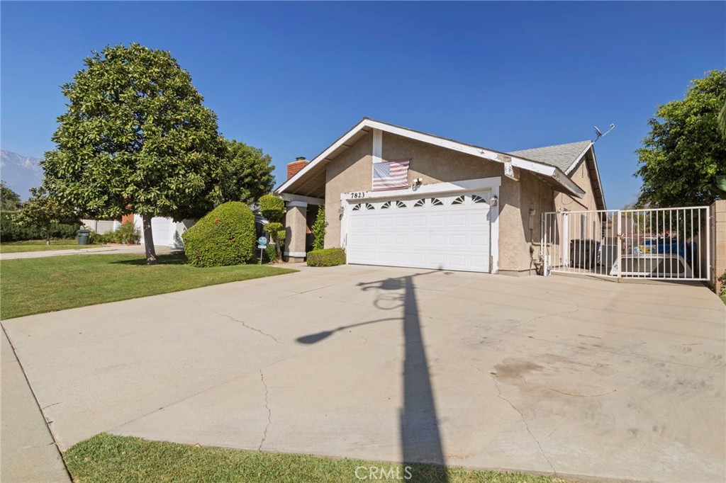 7823 Ramona Avenue Rancho Cucamonga, CA 91730 - Photo 2 of 18 a view of a house with a yard