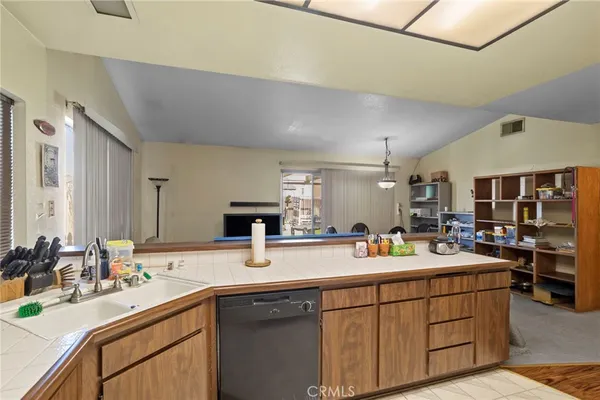 a kitchen with a sink and cabinets