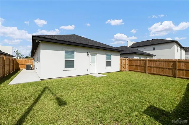 a view of an house with backyard space and balcony