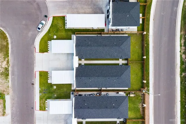 an aerial view of a house with a swimming pool
