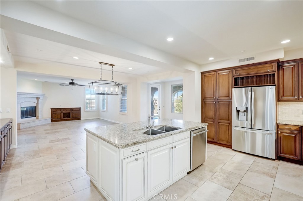 7 Tuscany Ladera Ranch, CA 92694 - Photo 11 of 39 a kitchen with stainless steel appliances granite countertop a refrigerator and a sink