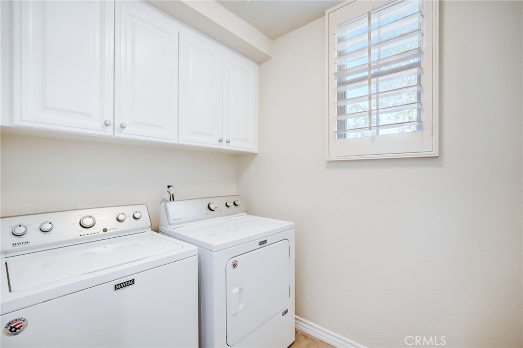 7 Tuscany Ladera Ranch, CA 92694 - Photo 12 of 39 a view of washer and dryer with bathroom in the background
