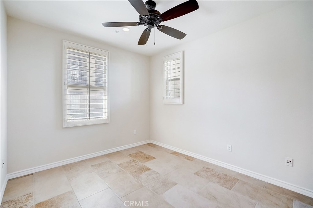 7 Tuscany Ladera Ranch, CA 92694 - Photo 13 of 39 an empty room with a window and a fan
