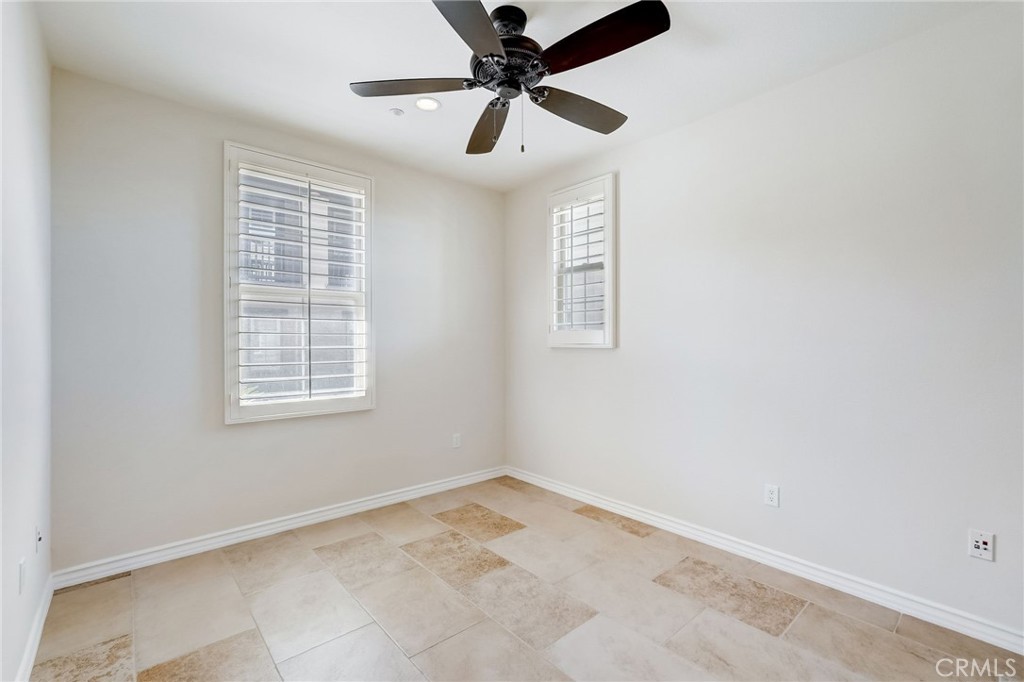 7 Tuscany Ladera Ranch, CA 92694 - Photo 15 of 39 an empty room with a window and a fan