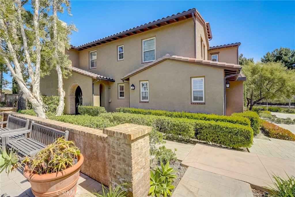 7 Tuscany Ladera Ranch, CA 92694 - Photo 2 of 39 a front view of a house with a yard